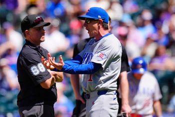Jun 11, 2026; Denver, Colorado, USA; MLB second base umpire Chris Guccione (68) listens to Chicago Cubs manager Craig Counsell (11) in the sixth inning against the Colorado Rockiesat Coors Field. Mandatory Credit: Ron Chenoy-Imagn Images