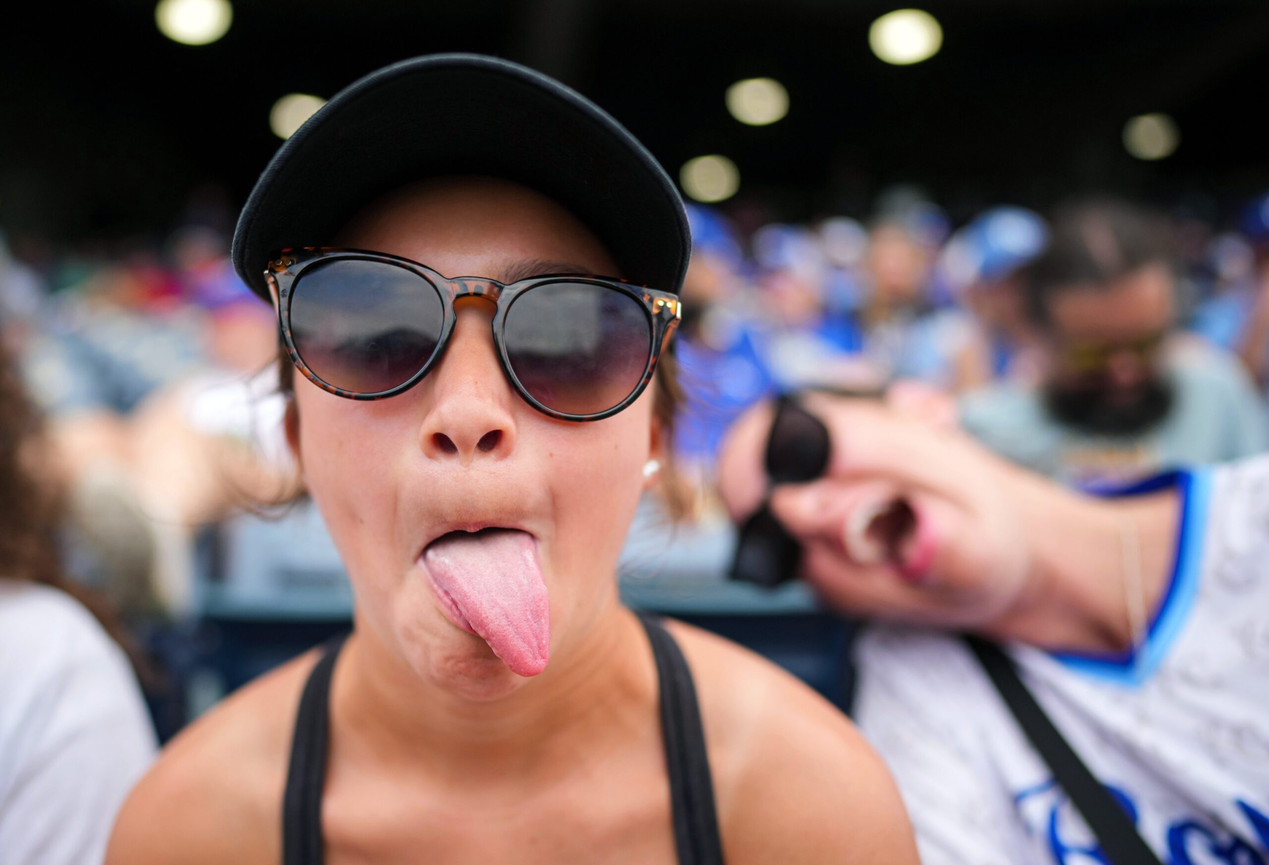 Jun 11, 2026; Kansas City, Missouri, USA; A young Kansas City Royals fan poses for a photo during the fourth inning against the Texas Rangers at Kauffman Stadium. Mandatory Credit: Jay Biggerstaff-Imagn Images