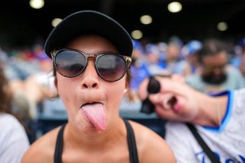 Jun 11, 2026; Kansas City, Missouri, USA; A young Kansas City Royals fan poses for a photo during the fourth inning against the Texas Rangers at Kauffman Stadium. Mandatory Credit: Jay Biggerstaff-Imagn Images