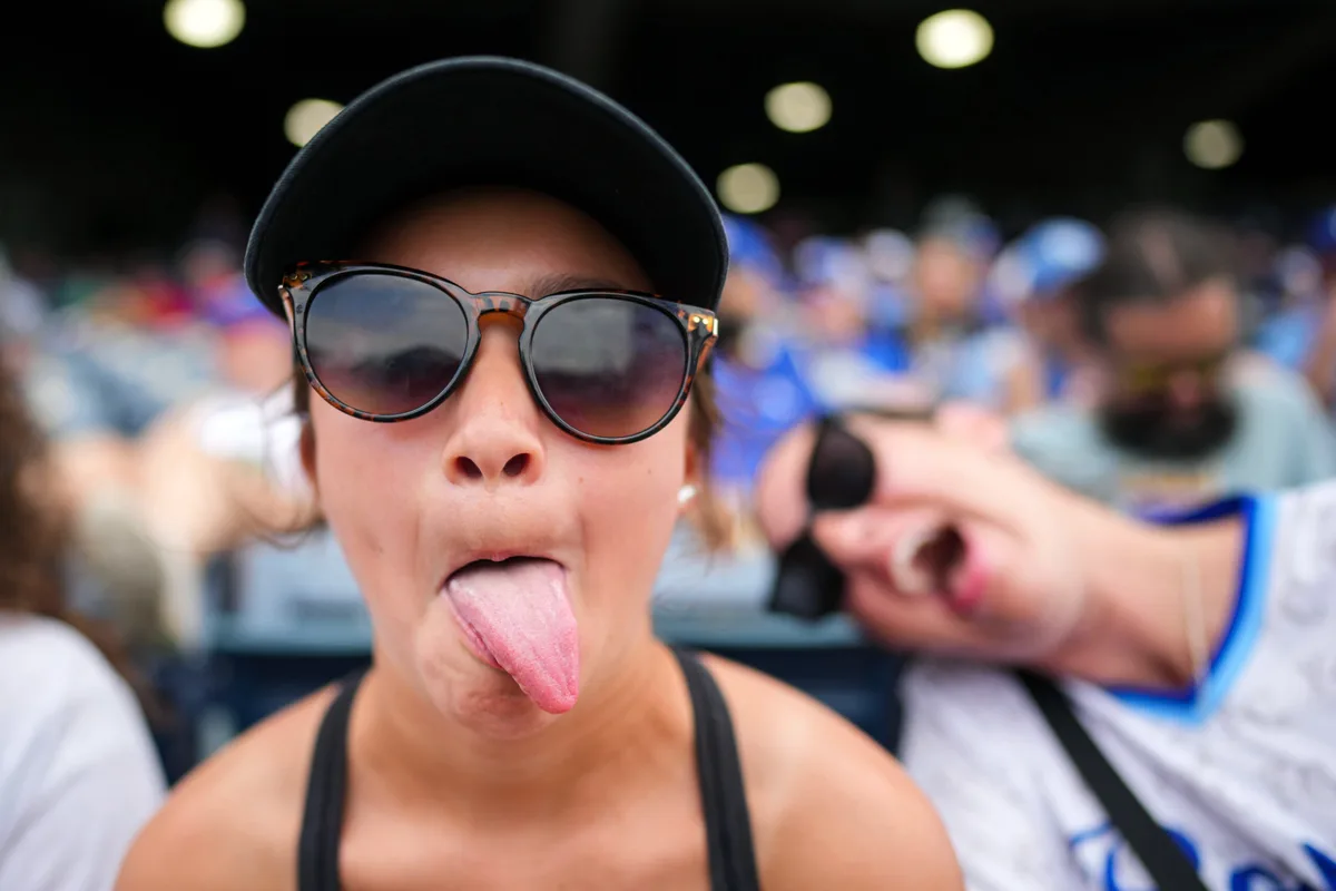 Jun 11, 2026; Kansas City, Missouri, USA; A young Kansas City Royals fan poses for a photo during the fourth inning against the Texas Rangers at Kauffman Stadium. Mandatory Credit: Jay Biggerstaff-Imagn Images
