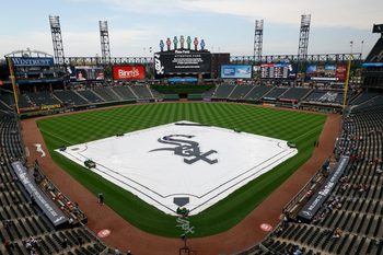 Jun 11, 2026; Chicago, Illinois, USA; A tarp covers the infield during a rain delay before a baseball game between the Chicago White Sox and Atlanta Braves at Rate Field. Mandatory Credit: Kamil Krzaczynski-Imagn Images