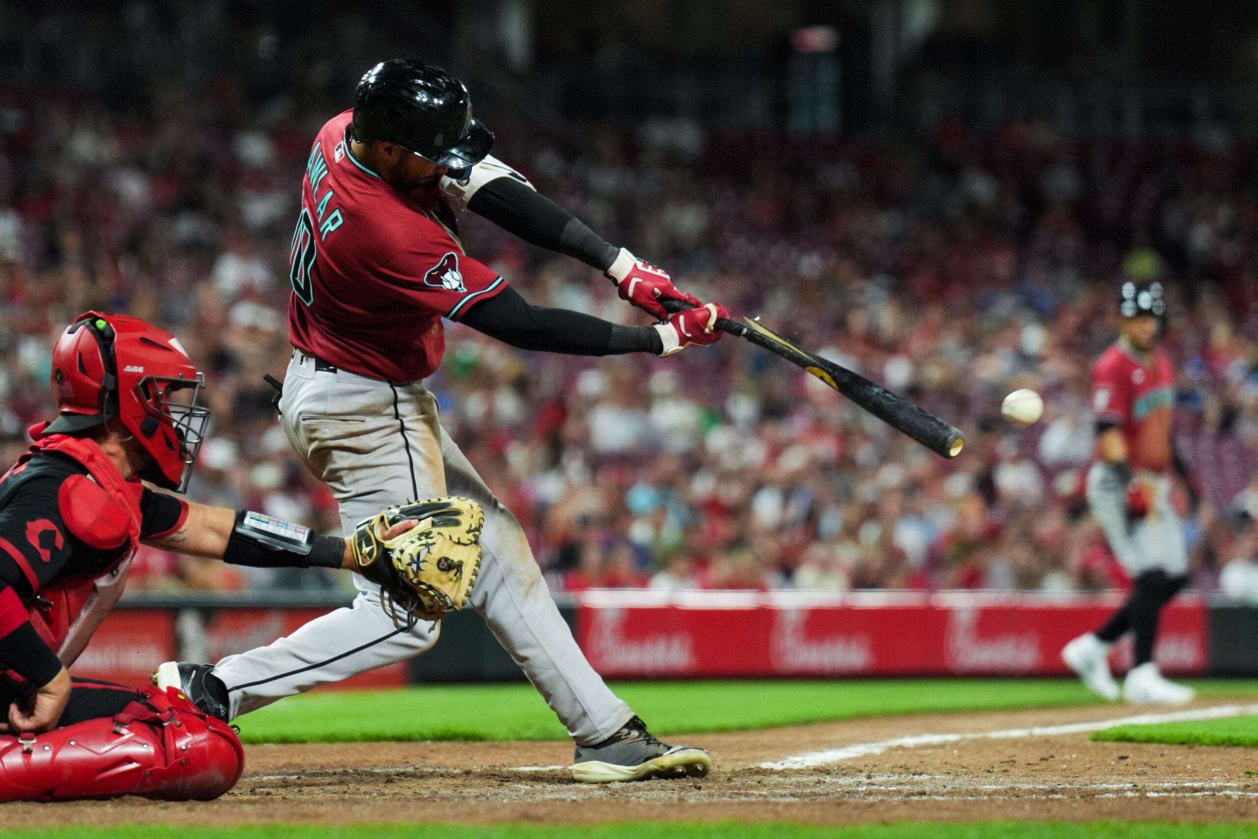 Jun 12, 2026; Cincinnati, Ohio, USA;  Arizona Diamondbacks outfielder Jordan Lawlar (10) breaks his bat as he hits a two-run single against the Cincinnati Reds in the ninth inning at Great American Ball Park. Mandatory Credit: Aaron Doster-Imagn Images