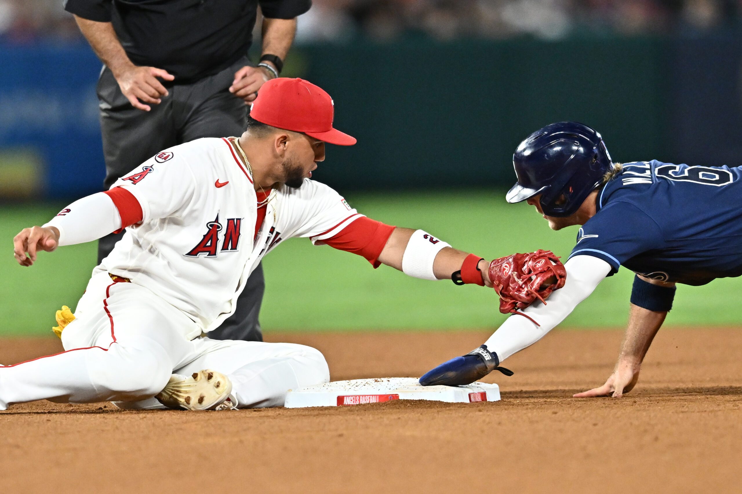 Jun 12, 2026; Anaheim, California, USA; Tampa Bay Rays shortstop Taylor Walls (6) beats a tag from Los Angeles Angels second baseman Oswald Peraza (2) during the seventh inning at Angel Stadium. Mandatory Credit: William Liang-Imagn Images