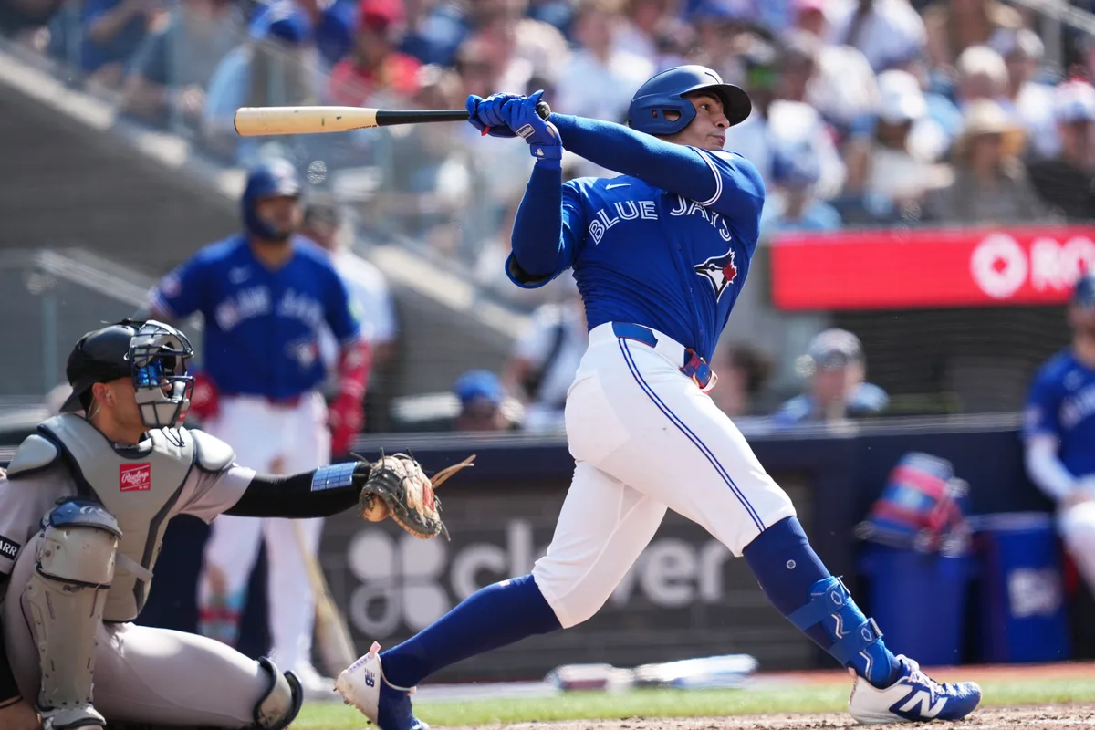 Jun 13, 2026; Toronto, Ontario, CAN; Toronto Blue Jays catcher Brandon Valenzuela (59) hits a single against the New York Yankees during the sixth inning at Rogers Centre. Mandatory Credit: Nick Turchiaro-Imagn Images