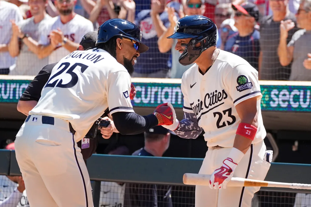 Jun 13, 2026; Minneapolis, Minnesota, USA; Minnesota Twins designated hitter Byron Buxton (25) celebrates his solo home run against the St. Louis Cardinals with first baseman Royce Lewis (23) in the fourth inning at Target Field. Mandatory Credit: Bruce Kluckhohn-Imagn Images