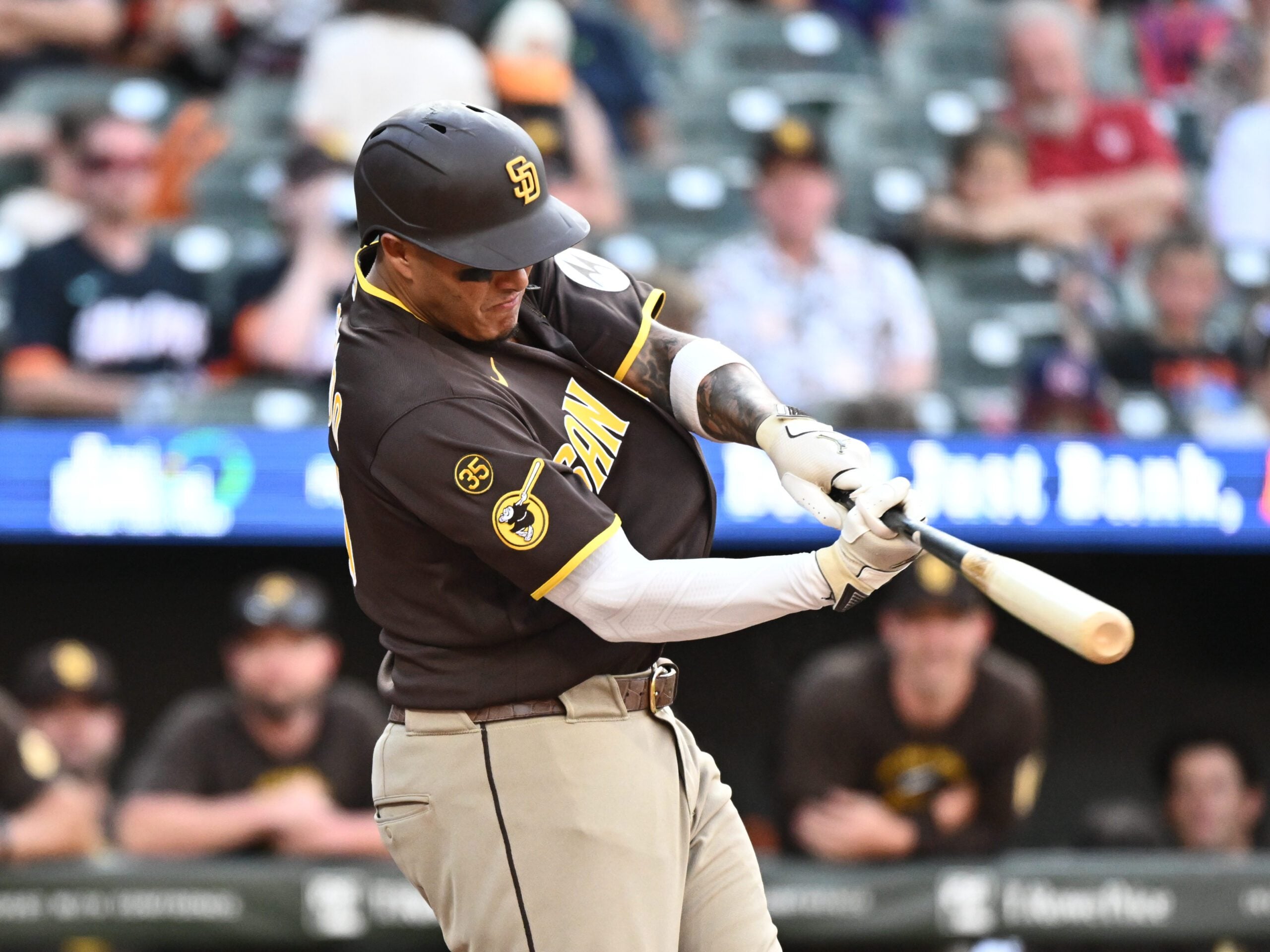 Jun 13, 2026; Baltimore, Maryland, USA;  San Diego Padres third baseman Manny Machado (13) hits a solo home run during the ninth inning against the Baltimore Orioles at Oriole Park at Camden Yards. Mandatory Credit: James A. Pittman-Imagn Images