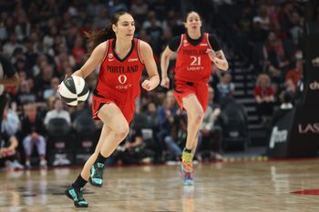 Jun 13, 2026; Portland, Oregon, USA;  Portland Fire guard Carla Leite (0) brings the ball up the court as forward Emily Engstler (21) follows during the first half against the Dallas Wings at Moda Center. Mandatory Credit: Jaime Valdez-Imagn Images