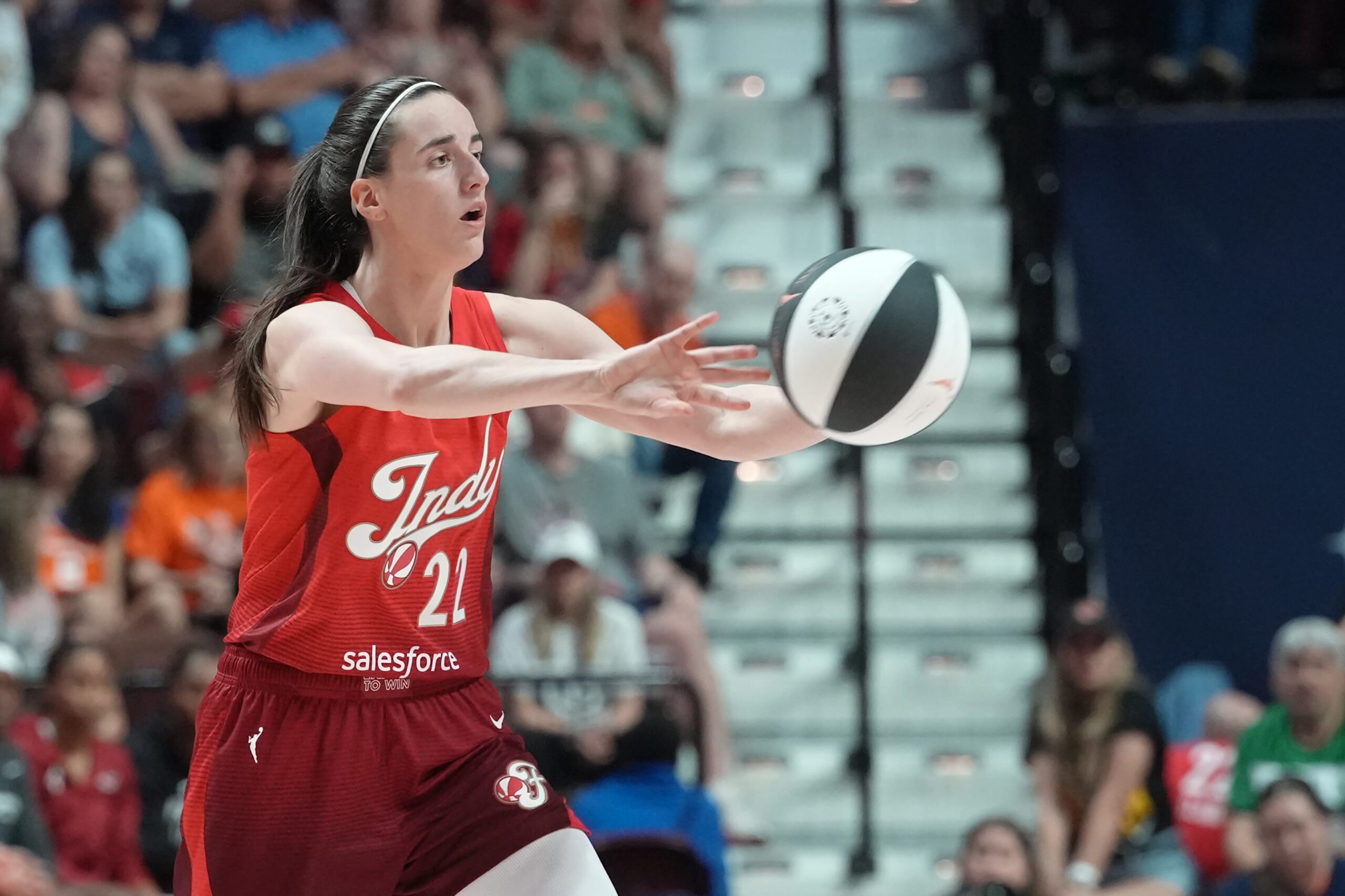 Jun 13, 2026; Uncasville, Connecticut, USA; Indiana Fever guard Caitlin Clark (22) passes the ball against the Connecticut Sun during the second half at Mohegan Sun Arena. Mandatory Credit: Gregory Fisher-Imagn Images