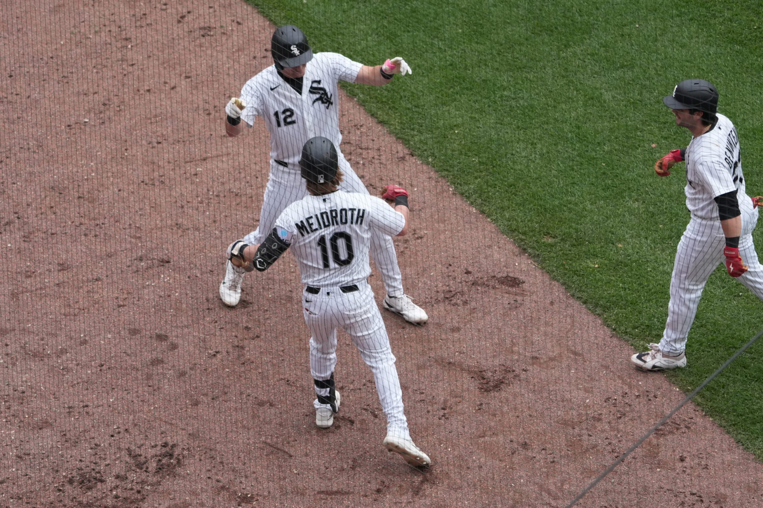 Jun 14, 2026; Chicago, Illinois, USA; Chicago White Sox shortstop Colson Montgomery (12) is greeted by second baseman Chase Meidroth (10) after hitting a two-run homerun against the Los Angeles Dodgers during the sixth inning at Rate Field. Mandatory Credit: David Banks-Imagn Images