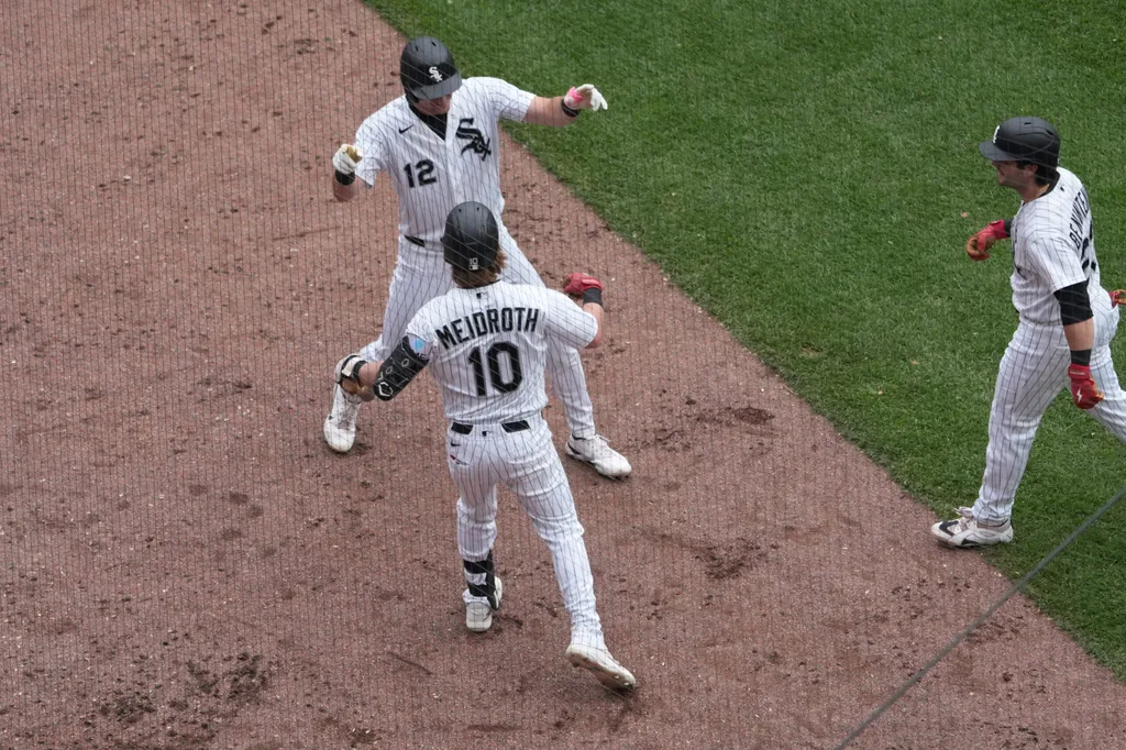 Jun 14, 2026; Chicago, Illinois, USA; Chicago White Sox shortstop Colson Montgomery (12) is greeted by second baseman Chase Meidroth (10) after hitting a two-run homerun against the Los Angeles Dodgers during the sixth inning at Rate Field. Mandatory Credit: David Banks-Imagn Images