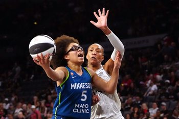 Jun 13, 2026; Las Vegas, Nevada, USA; Minnesota Lynx guard Olivia Miles (5) looks to shoot in front of Las Vegas Aces center A'ja Wilson (22) during the second quarter at Michelob Ultra Arena. Mandatory Credit: Stephen R. Sylvanie-Imagn Images