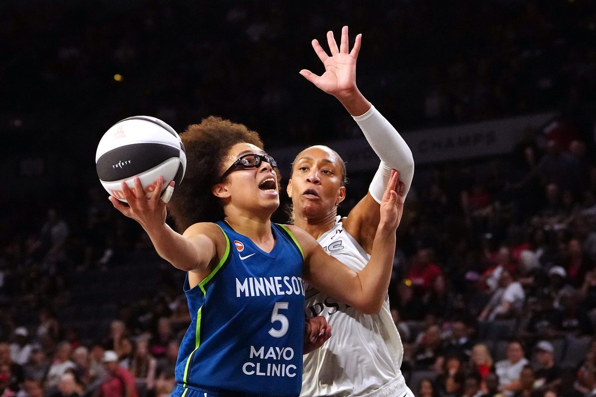 Jun 13, 2026; Las Vegas, Nevada, USA; Minnesota Lynx guard Olivia Miles (5) looks to shoot in front of Las Vegas Aces center A'ja Wilson (22) during the second quarter at Michelob Ultra Arena. Mandatory Credit: Stephen R. Sylvanie-Imagn Images