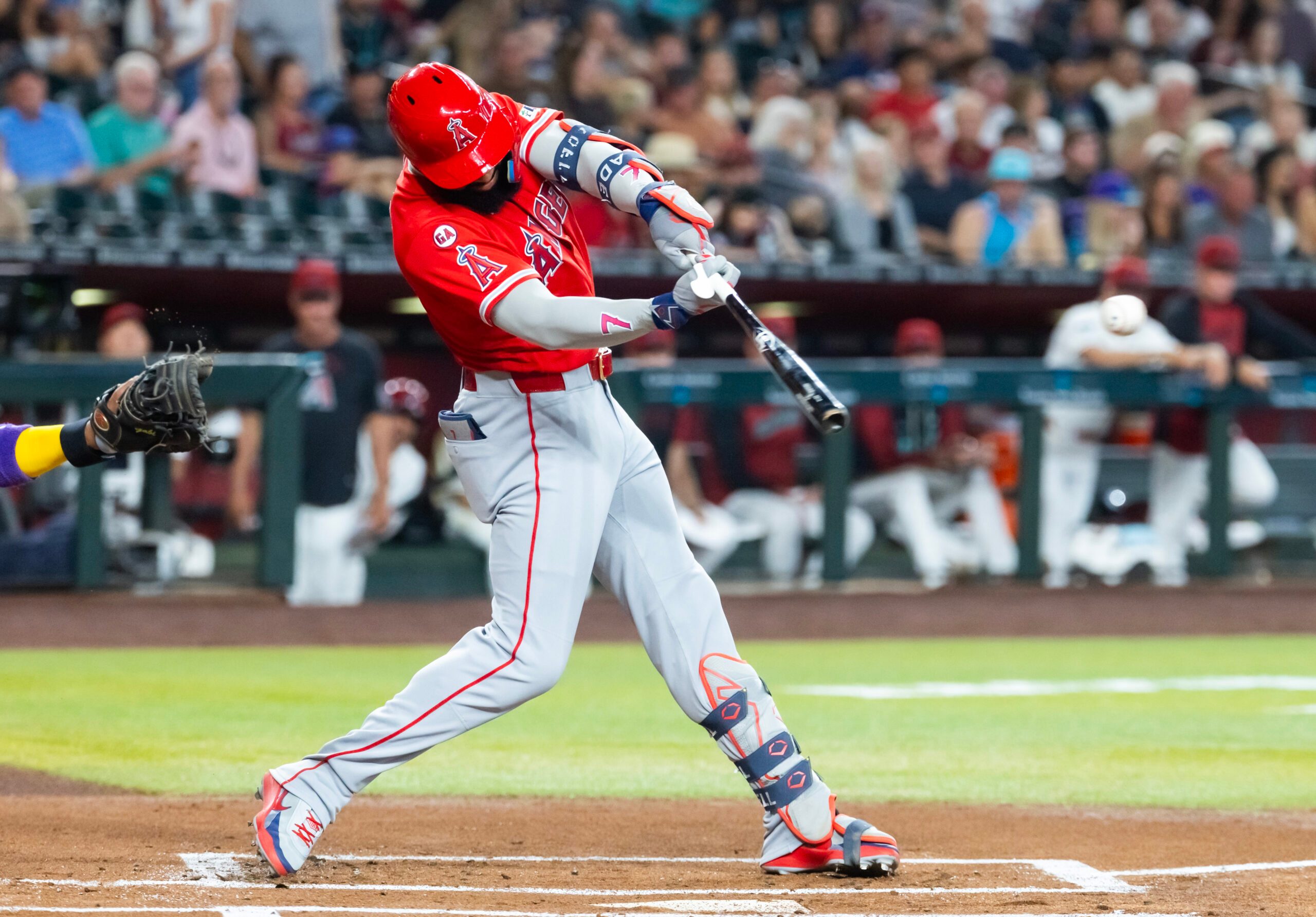 Jun 15, 2026; Phoenix, Arizona, USA; Los Angeles Angels outfielder Jo Adell hits an RBI double in the first inning against the Arizona Diamondbacks at Chase Field. Mandatory Credit: Mark J. Rebilas-Imagn Images