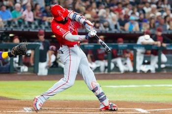 Jun 15, 2026; Phoenix, Arizona, USA; Los Angeles Angels outfielder Jo Adell hits an RBI double in the first inning against the Arizona Diamondbacks at Chase Field. Mandatory Credit: Mark J. Rebilas-Imagn Images