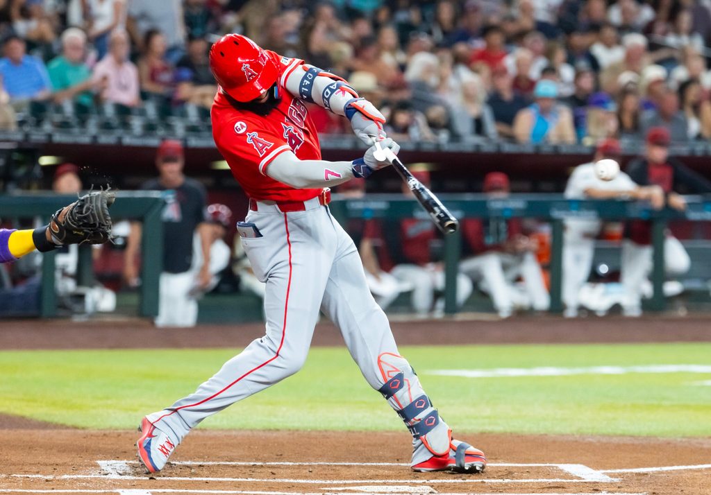 Jun 15, 2026; Phoenix, Arizona, USA; Los Angeles Angels outfielder Jo Adell hits an RBI double in the first inning against the Arizona Diamondbacks at Chase Field. Mandatory Credit: Mark J. Rebilas-Imagn Images