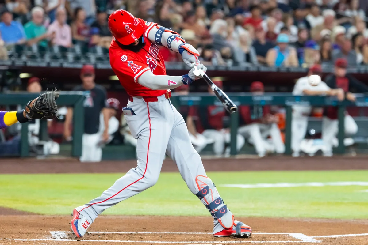 Jun 15, 2026; Phoenix, Arizona, USA; Los Angeles Angels outfielder Jo Adell hits an RBI double in the first inning against the Arizona Diamondbacks at Chase Field. Mandatory Credit: Mark J. Rebilas-Imagn Images