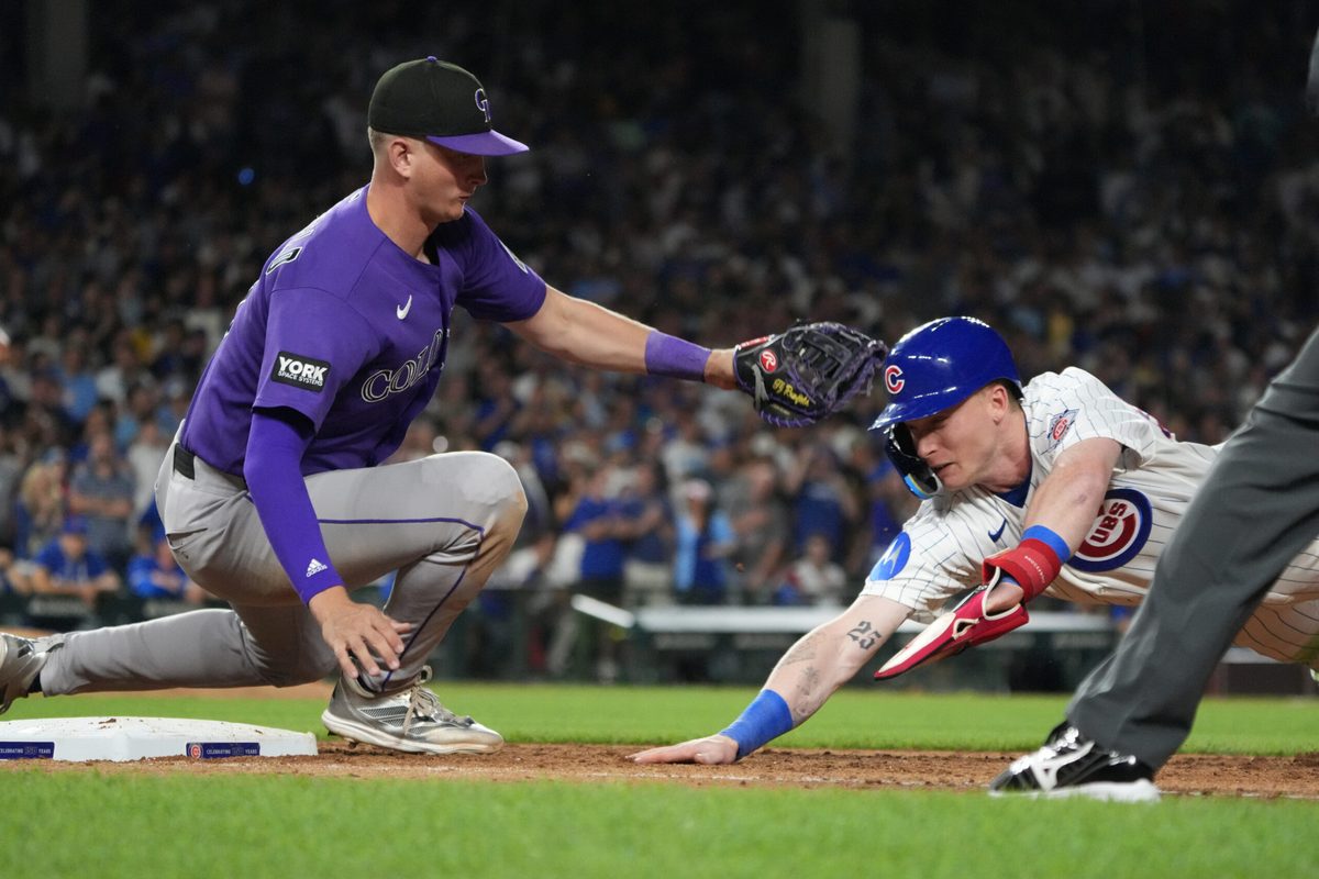 Jun 15, 2026; Chicago, Illinois, USA; Chicago Cubs center fielder Pete Crow-Armstrong (4) is tagged out at first base by Colorado Rockies first baseman TJ Rumfield (7) on a pick-off during the seventh inning Wrigley Field. Mandatory Credit: David Banks-Imagn Images