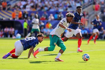 June 16, 2026; East Rutherford, New Jersey, U.S.; Senegal's Ibrahim Mbaye scores their first goal in action with France's Theo Hernandez.  Mandatory Credit: Caean Couto-Imagn Images