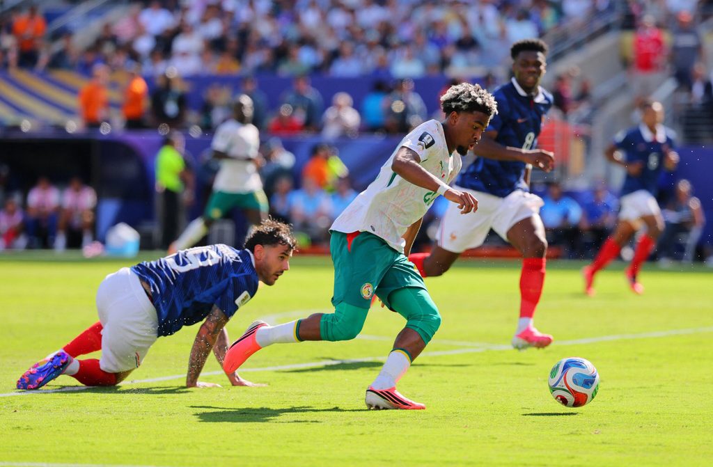 June 16, 2026; East Rutherford, New Jersey, U.S.; Senegal's Ibrahim Mbaye scores their first goal in action with France's Theo Hernandez. Mandatory Credit: Caean Couto-Imagn Images