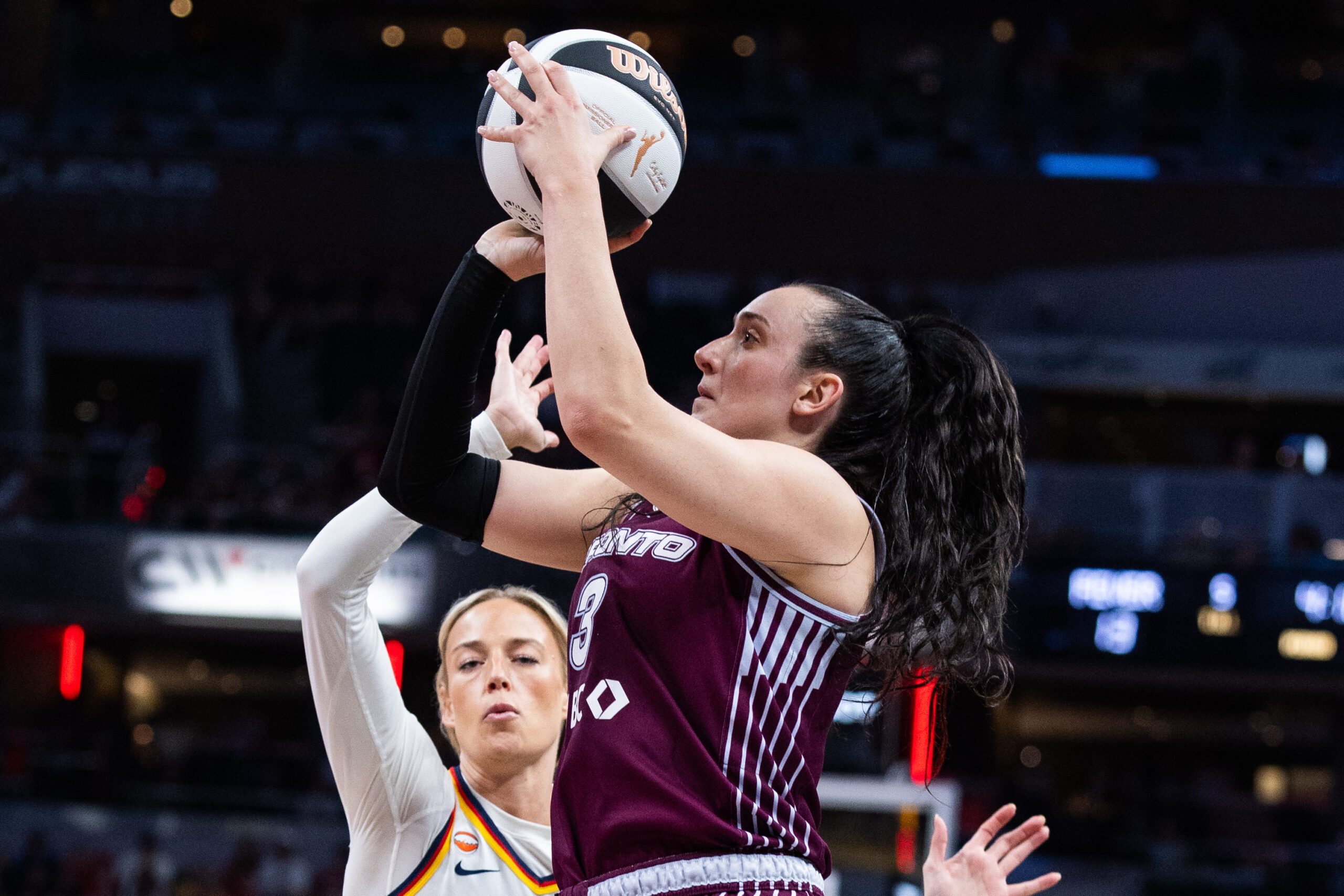 Jun 16, 2026; Indianapolis, Indiana, USA;  Toronto Tempo guard Marina Mabrey (3) shoots the ball while Indiana Fever guard Sophie Cunningham (8) defends in the first half at Gainbridge Fieldhouse. Mandatory Credit: Trevor Ruszkowski-Imagn Images