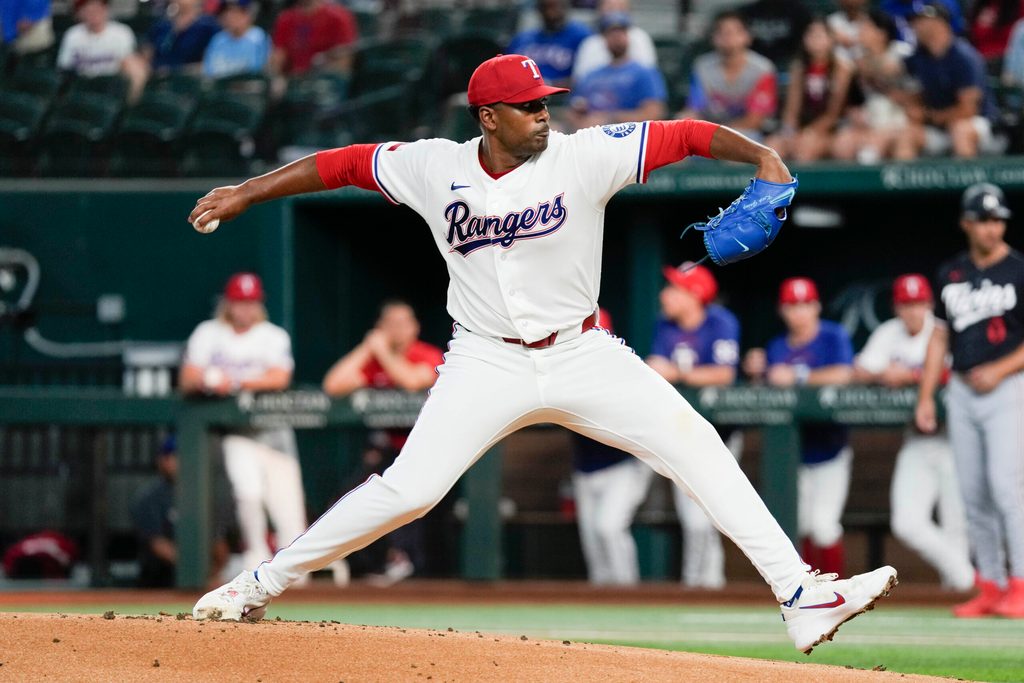 Jun 16, 2026; Arlington, Texas, USA; Texas Rangers starting pitcher Kumar Rocker (80) delivers a pitch to the Minnesota Twins during the first inning at Globe Life Field. Mandatory Credit: Jim Cowsert-Imagn Images