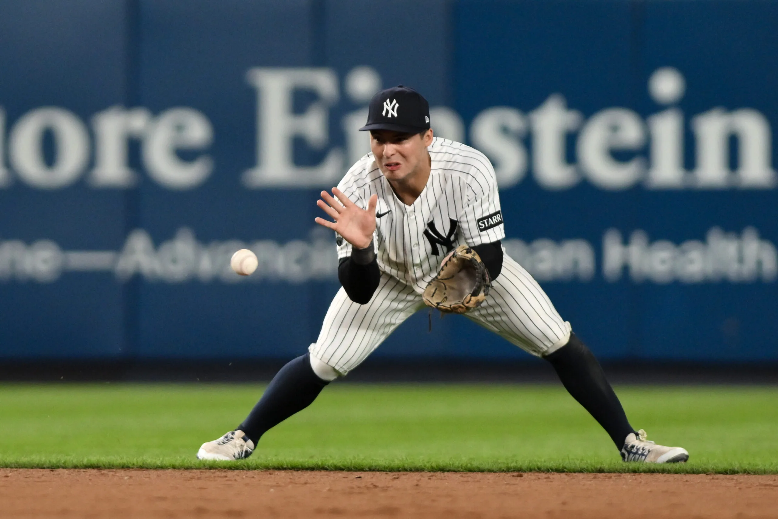 Jun 16, 2026; Bronx, New York, USA; New York Yankees shortstop Anthony Volpe (11) fields a ground ball hit by Chicago White Sox center fielder Luisangel Acuña (not pictured) and throws to first base for an out during the ninth inning at Yankee Stadium. Mandatory Credit: John Jones-Imagn Images