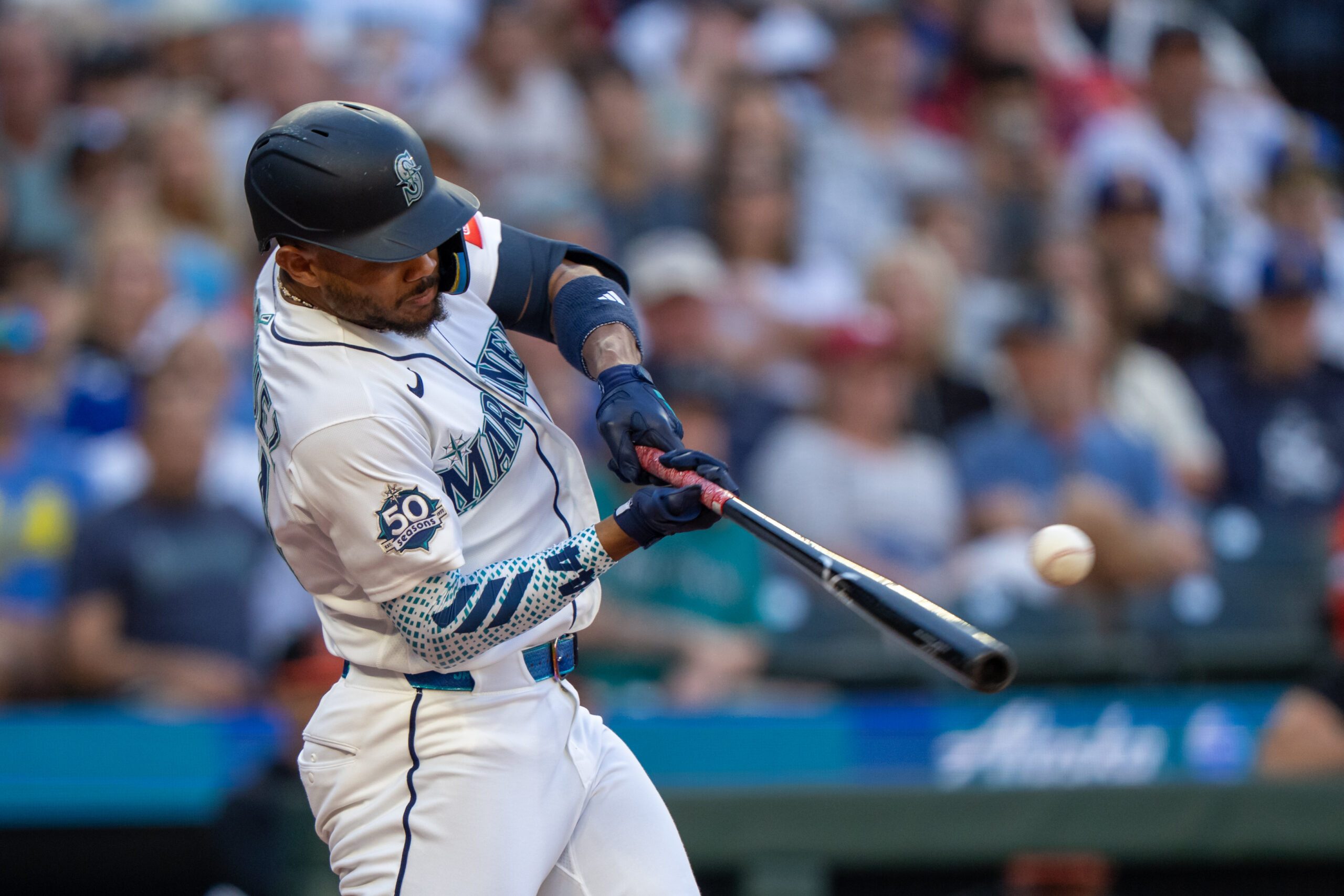 Jun 16, 2026; Seattle, Washington, USA;  Seattle Mariners centerfielder Julio Rodriguez (44) hits a RBI-single during the third inning against the Baltimore Orioles at T-Mobile Park. Mandatory Credit: Stephen Brashear-Imagn Images
