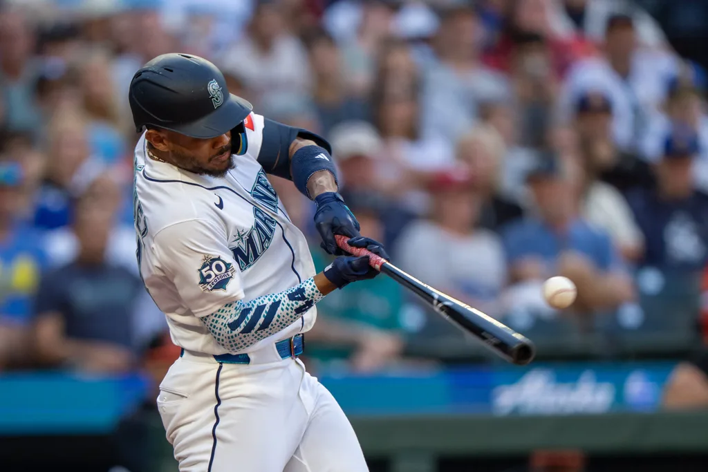 Jun 16, 2026; Seattle, Washington, USA; Seattle Mariners centerfielder Julio Rodriguez (44) hits a RBI-single during the third inning against the Baltimore Orioles at T-Mobile Park. Mandatory Credit: Stephen Brashear-Imagn Images