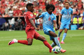 June 17, 2026; Houston, Texas, U.S.; Portugal's Nelson Semedo in action with DR Congo's Samuel Moutoussamy.  Mandatory Credit: Troy Taormina-Imagn Images