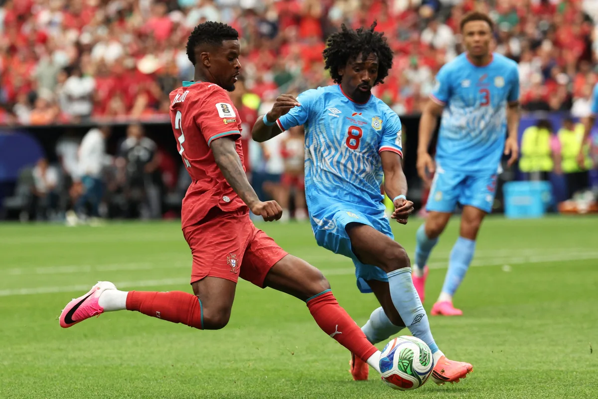 June 17, 2026; Houston, Texas, U.S.; Portugal's Nelson Semedo in action with DR Congo's Samuel Moutoussamy. Mandatory Credit: Troy Taormina-Imagn Images