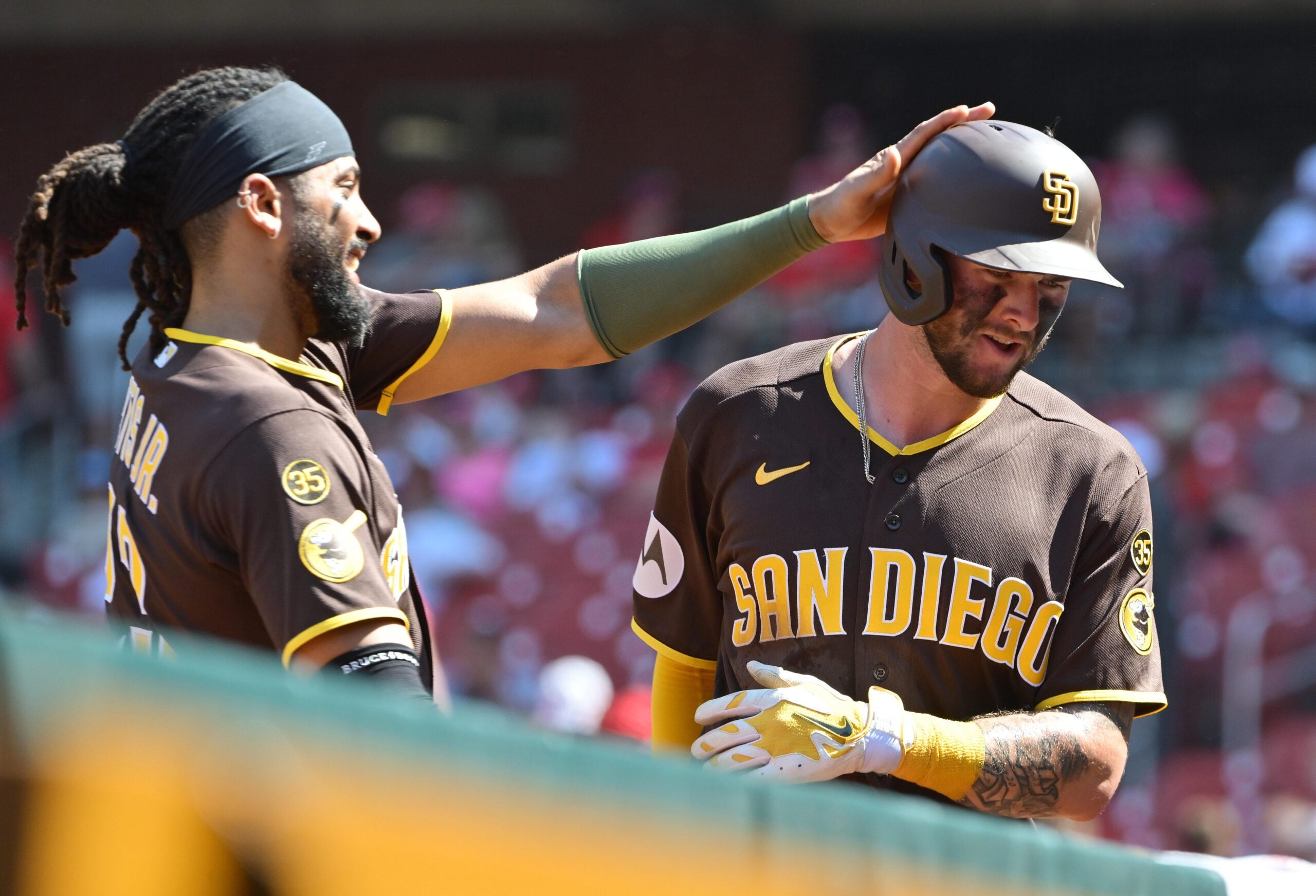 Jun 17, 2026; St. Louis, Missouri, USA; San Diego Padres right fielder Fernando Tatis Jr. (23, left) congratulates San Diego Padres center fielder Jackson Merrill (3) at the dugout after Merrill hit a ninth inning home run against the St. Louis Cardinals at Busch Stadium. Mandatory Credit: Tim Vizer-Imagn Images