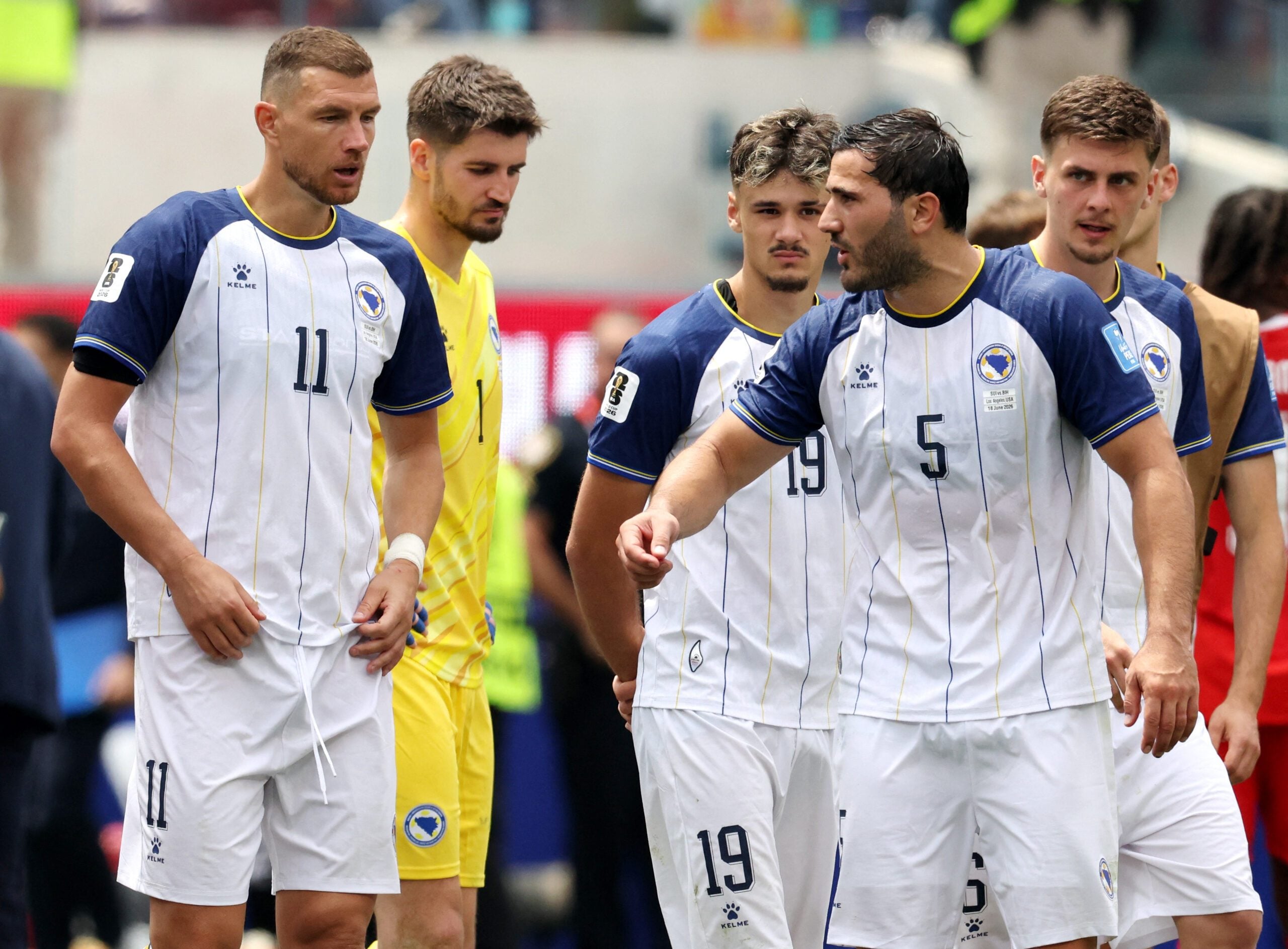 June 18, 2026; Inglewood, California, U.S.; Bosnia and Herzegovina's Edin Dzeko and Sead Kolasinac look dejected after the match.  Mandatory Credit: Kiyoshi Mio-Imagn Images