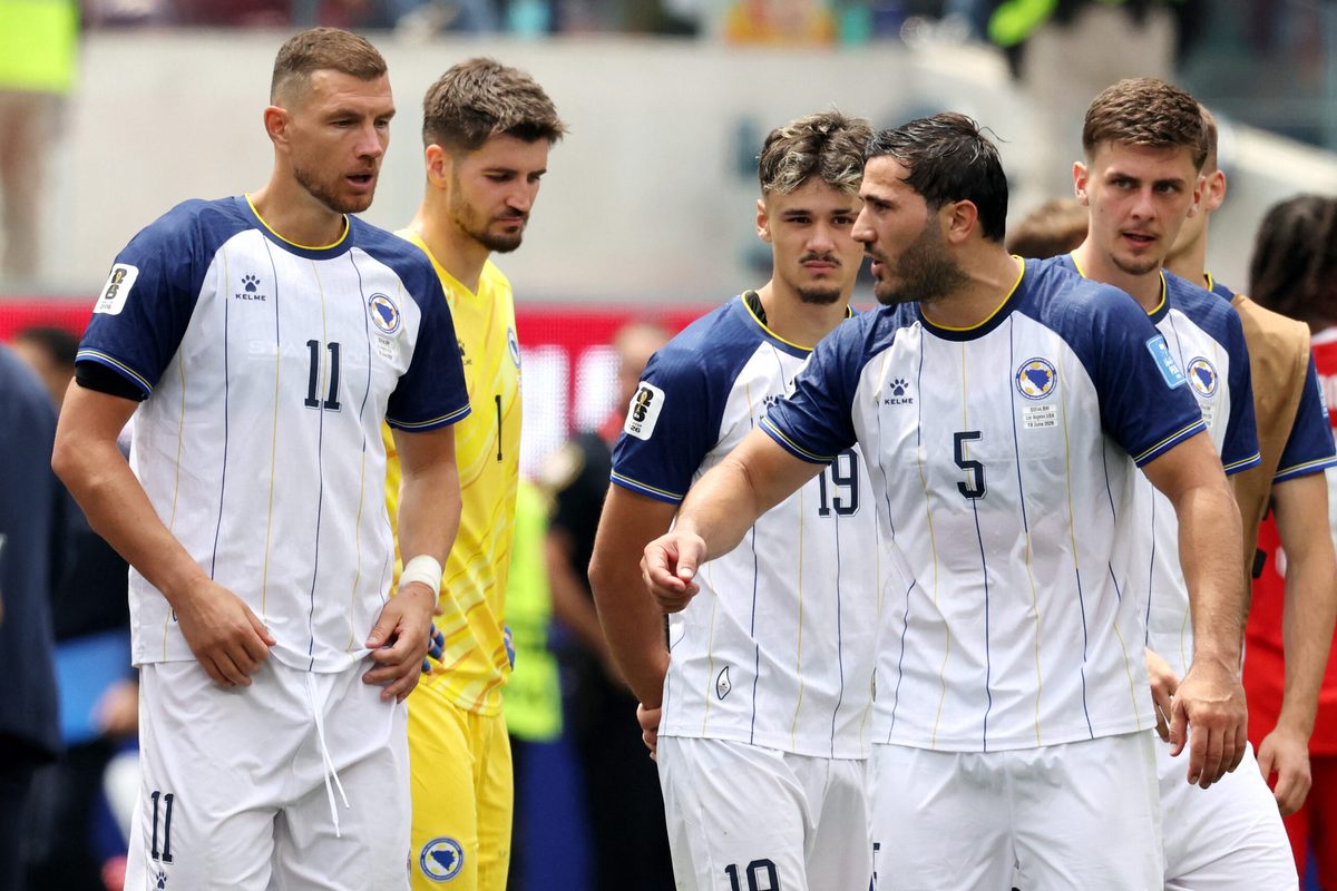 June 18, 2026; Inglewood, California, U.S.; Bosnia and Herzegovina's Edin Dzeko and Sead Kolasinac look dejected after the match.  Mandatory Credit: Kiyoshi Mio-Imagn Images