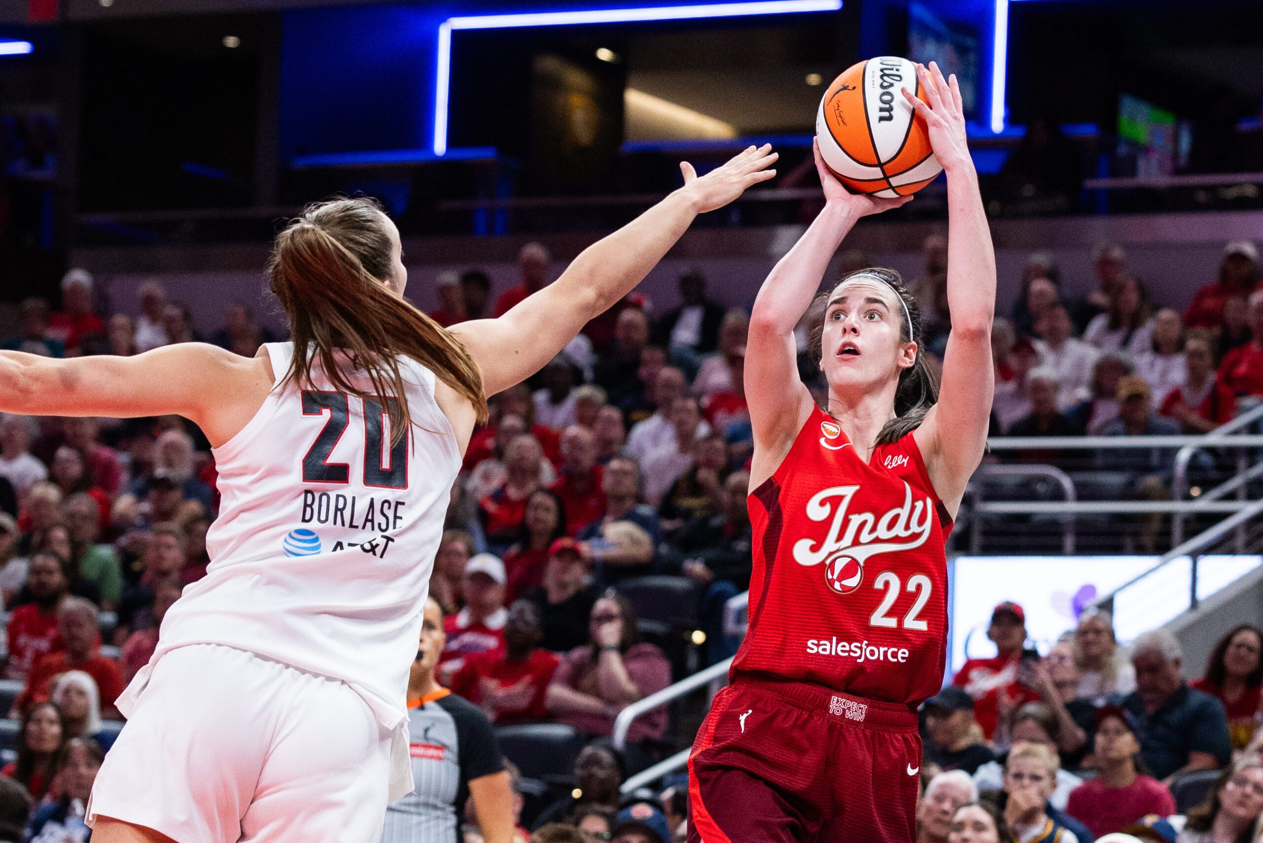 Jun 18, 2026; Indianapolis, Indiana, USA; Indiana Fever guard Caitlin Clark (22) shoots against Atlanta Dream guard Isobel Borlase (20) in the second half at Gainbridge Fieldhouse. Mandatory Credit: Trevor Ruszkowski-Imagn Images