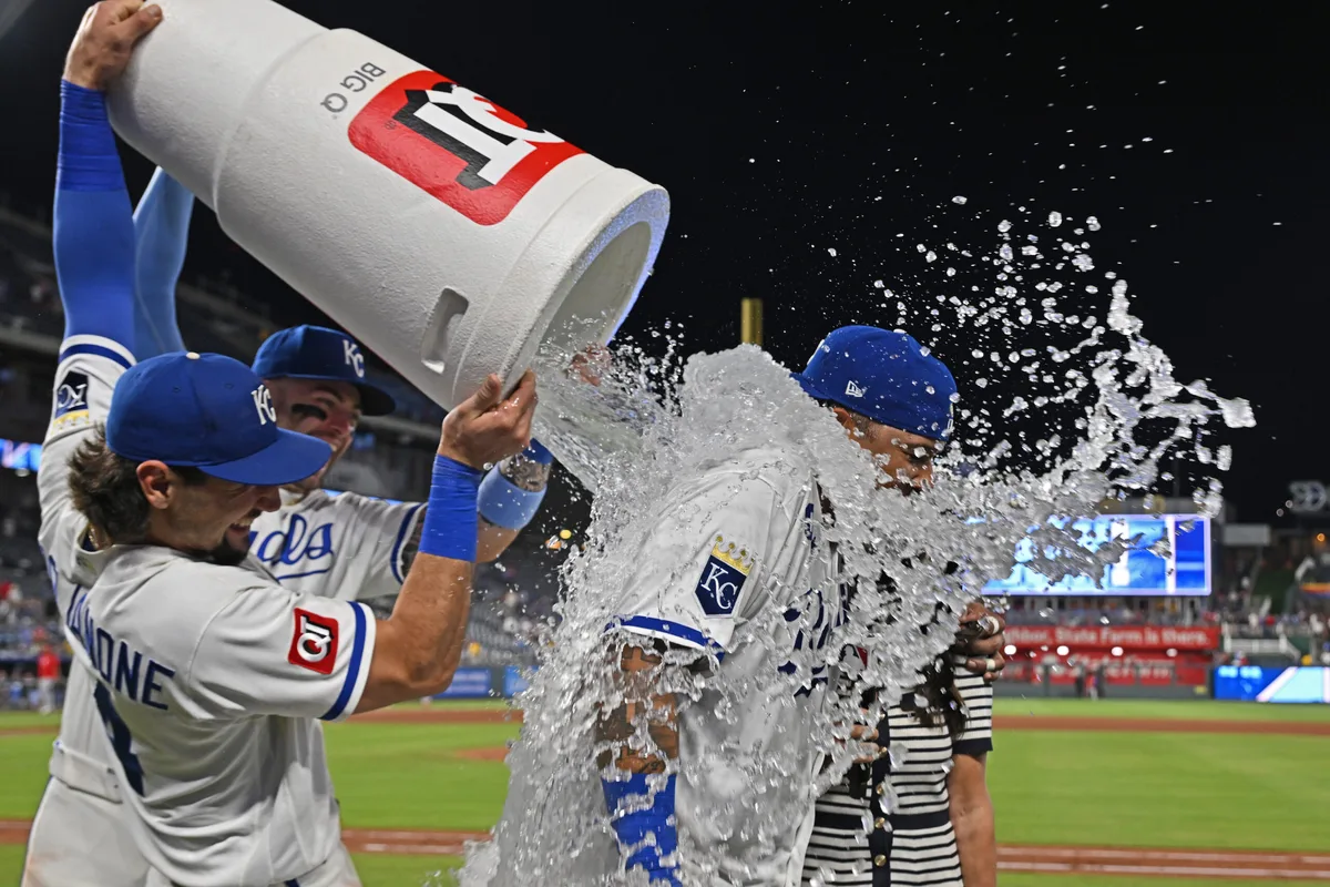 Jun 18, 2026; Kansas City, Missouri, USA; Kansas City Royals catcher Salvador Perez (13) gets a victory dunk from first baseman Jac Caglianone (14) and designated hitter Carter Jensen (22) after defeating the St. Louis Cardinals at Kauffman Stadium. Mandatory Credit: Peter Aiken-Imagn Images