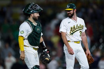 Jun 18, 2026; West Sacramento, California, USA; Athletics catcher Shea Langeliers (23) and pitcher Hogan Harris (36) walk off the field after a game against the Los Angeles Angels at Sutter Health Park. Mandatory Credit: Sergio Estrada-Imagn Images