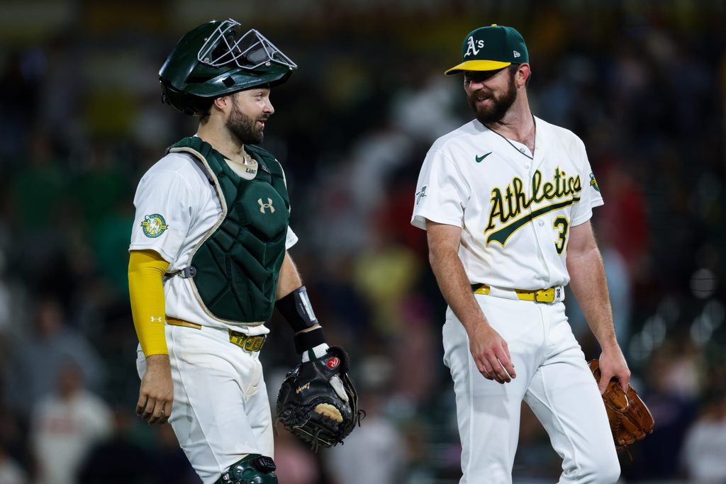 Jun 18, 2026; West Sacramento, California, USA; Athletics catcher Shea Langeliers (23) and pitcher Hogan Harris (36) walk off the field after a game against the Los Angeles Angels at Sutter Health Park. Mandatory Credit: Sergio Estrada-Imagn Images