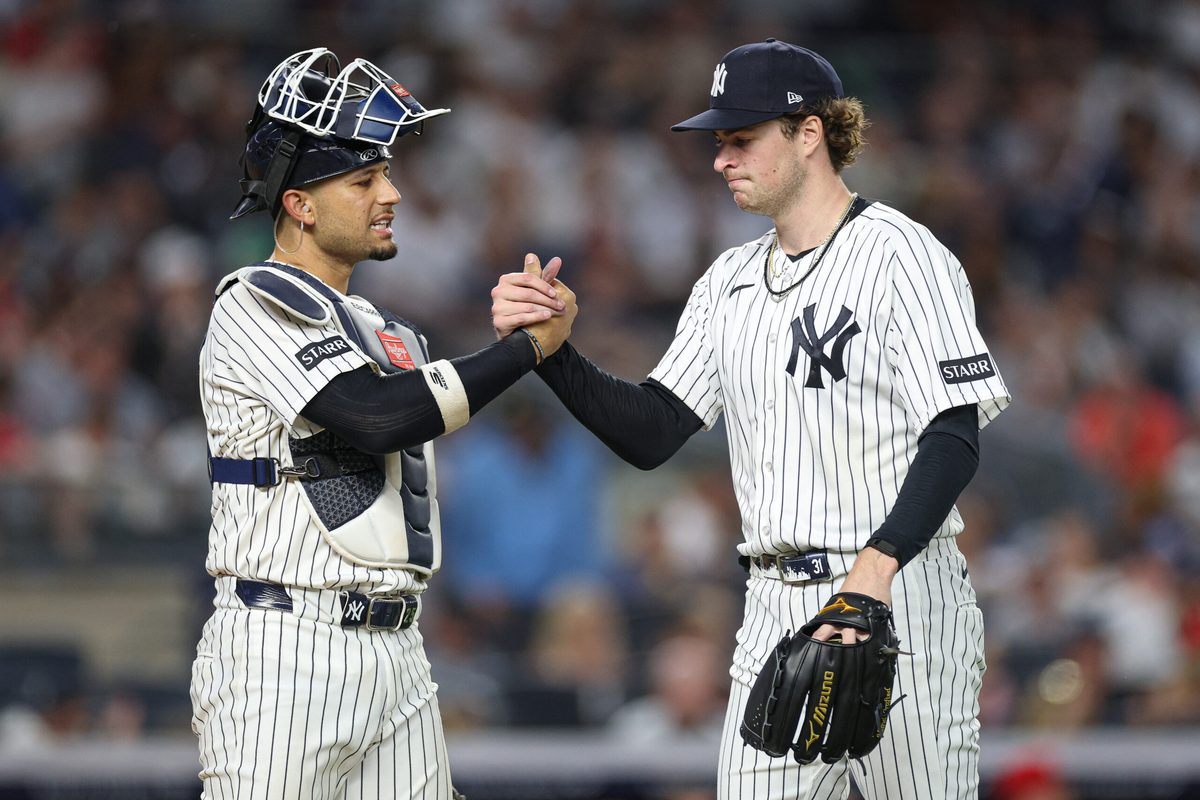 Jun 19, 2026; Bronx, New York, USA; New York Yankees pitcher Cam Schlittler (31) shakes hands with catcher J.C. Escarra (25) after the top of the sixth inning against the Cincinnati Reds at Yankee Stadium. Mandatory Credit: Vincent Carchietta-Imagn Images