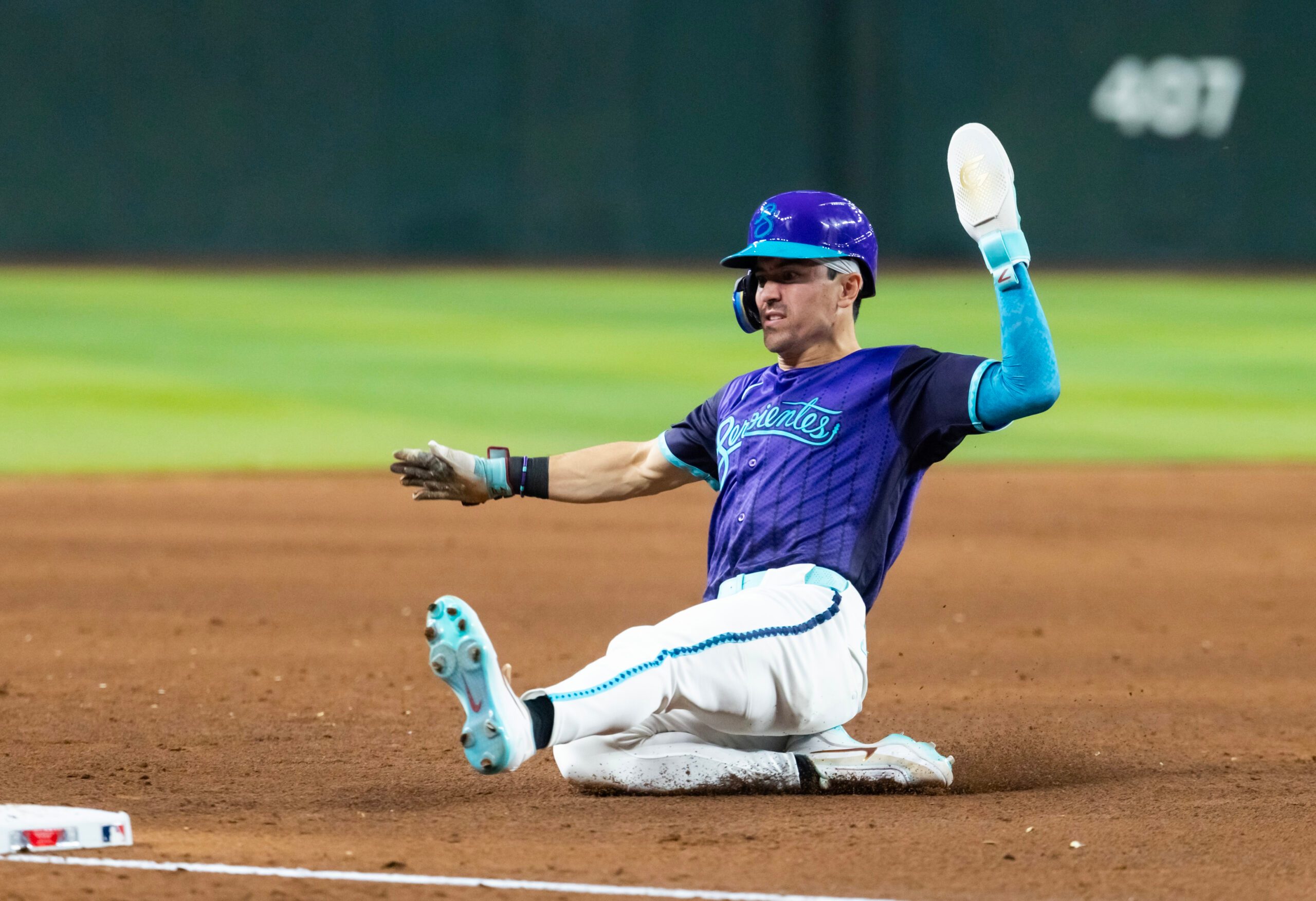 Jun 19, 2026; Phoenix, Arizona, USA; Arizona Diamondbacks outfielder Corbin Carroll slides into third base in the fifth inning against the Minnesota Twins at Chase Field. Mandatory Credit: Mark J. Rebilas-Imagn Images