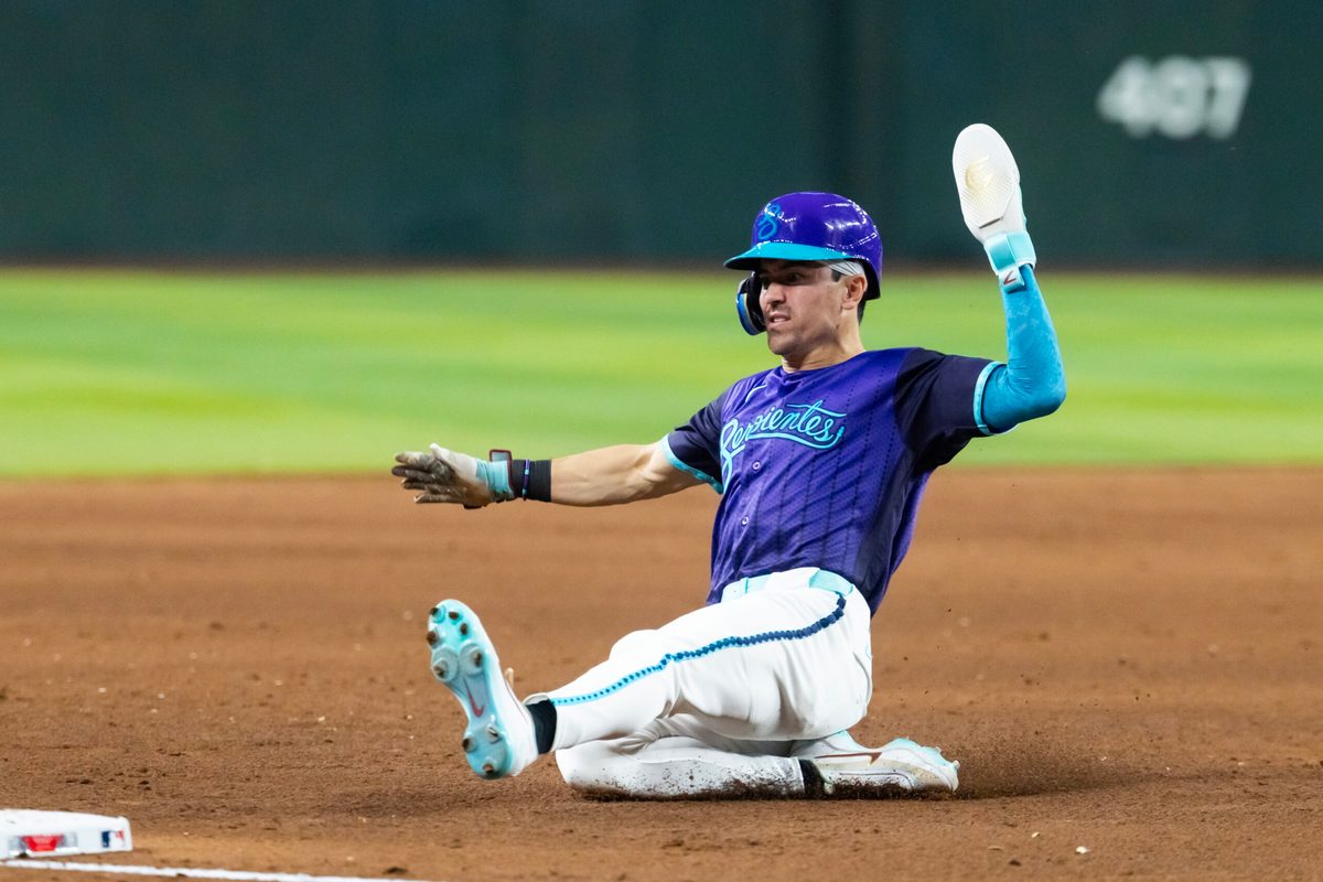Jun 19, 2026; Phoenix, Arizona, USA; Arizona Diamondbacks outfielder Corbin Carroll slides into third base in the fifth inning against the Minnesota Twins at Chase Field. Mandatory Credit: Mark J. Rebilas-Imagn Images