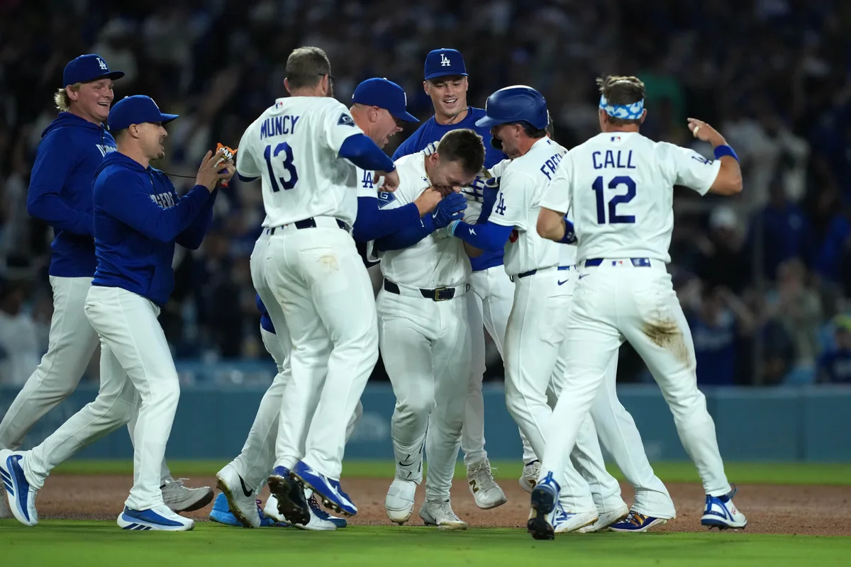 Jun 19, 2026; Los Angeles, California, USA; Los Angeles Dodgers catcher Dalton Rushing (68) celebrates with third baseman Max Muncy (13), second baseman Alex Freeland (76) and left fielder Alex Call (12) after hitting a walk-off single against the Baltimore Orioles at Dodger Stadium. Mandatory Credit: Kirby Lee-Imagn Images