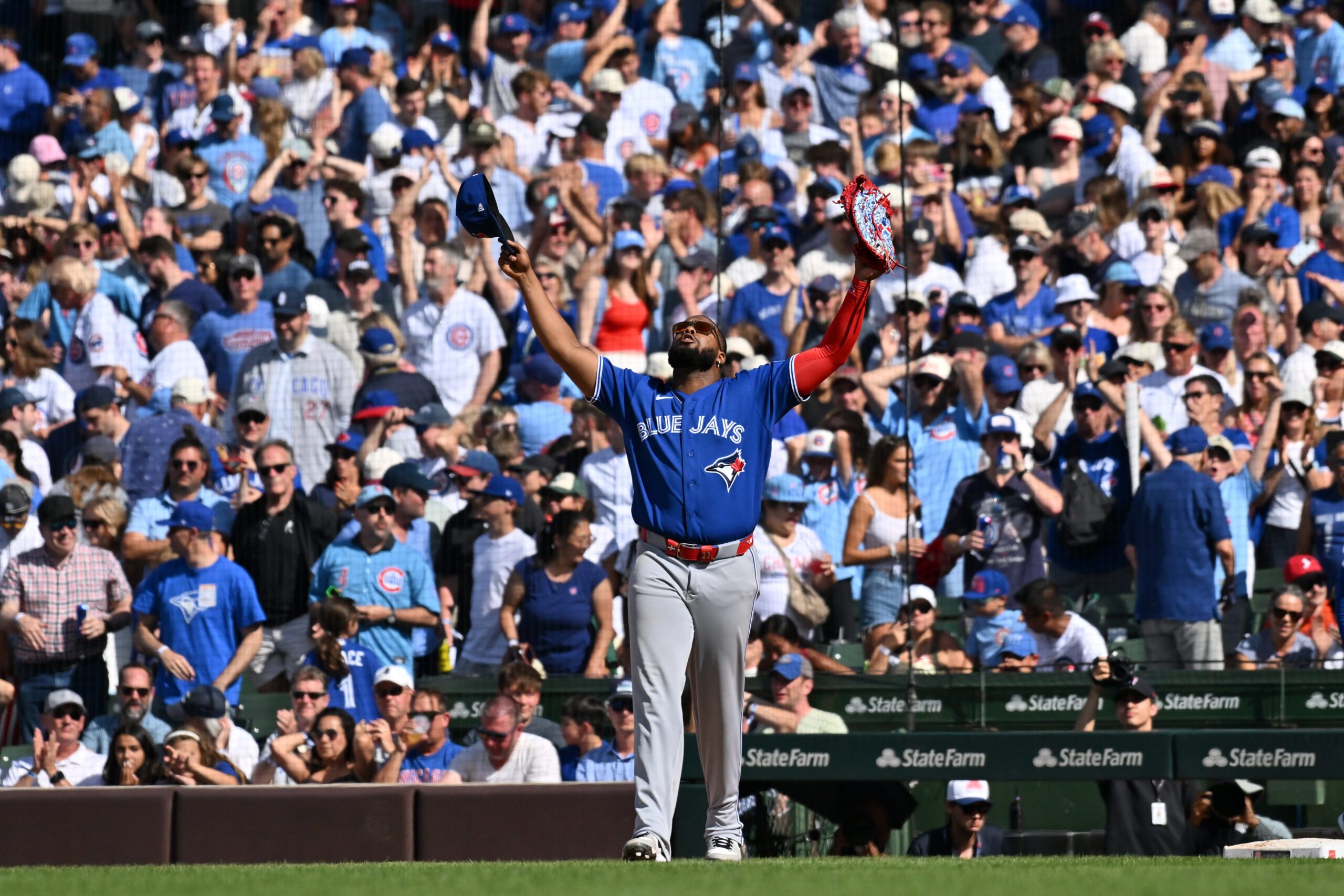 Jun 20, 2026; Chicago, Illinois, USA; Toronto Blue Jays first baseman Vladimir Guerrero Jr. (27) celebrates after defeating the Chicago Cubs at Wrigley Field. Mandatory Credit: Patrick Gorski-Imagn Images