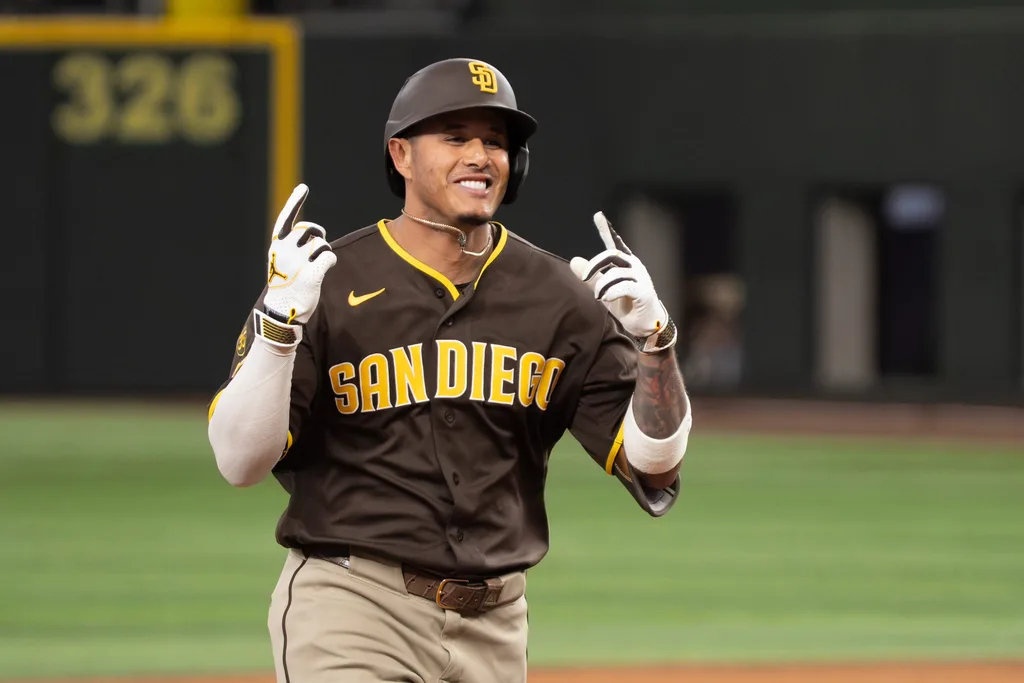 Jun 20, 2026; Arlington, Texas, USA; San Diego Padres third baseman Manny Machado (13) circles the bases after hitting a three-run home run against the Texas Rangers during the tenth inning at Globe Life Field. Mandatory Credit: Raymond Carlin III-Imagn Images