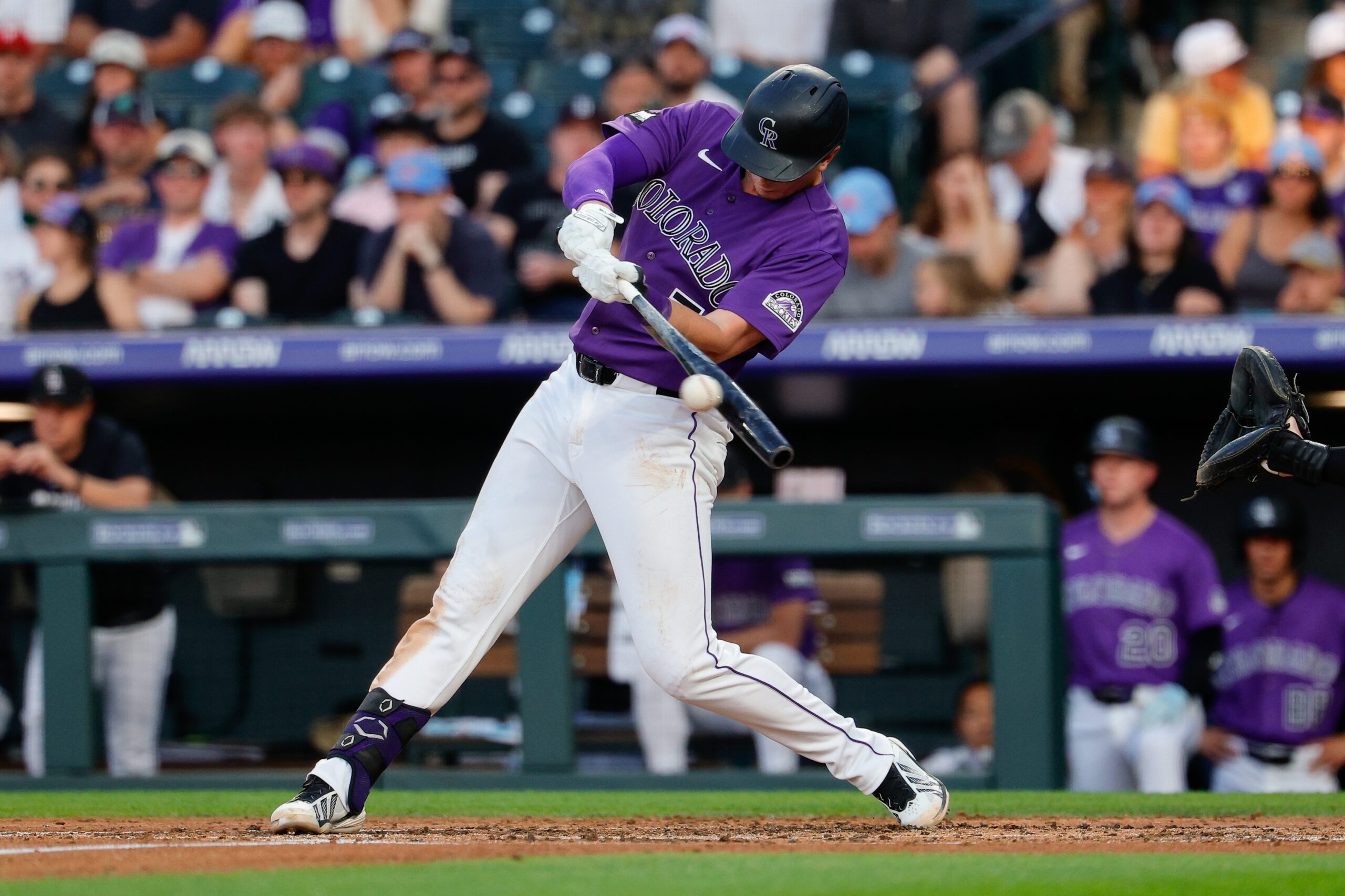 Jun 20, 2026; Denver, Colorado, USA; Colorado Rockies first baseman TJ Rumfield (7) hits an RBI single in the third inning against the Pittsburgh Pirates at Coors Field. Mandatory Credit: Isaiah J. Downing-Imagn Images