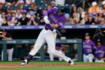 Jun 20, 2026; Denver, Colorado, USA; Colorado Rockies first baseman TJ Rumfield (7) hits an RBI single in the third inning against the Pittsburgh Pirates at Coors Field. Mandatory Credit: Isaiah J. Downing-Imagn Images