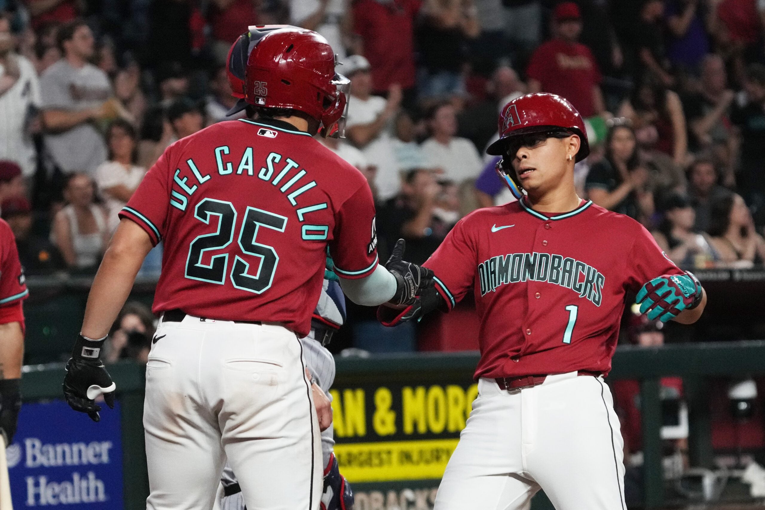 Jun 20, 2026; Phoenix, Arizona, USA; Arizona Diamondbacks center fielder Jorge Barrosa (1) celebrates with Adrian del Castillo (25) after hitting a two-run home run against the Minnesota Twins in the fifth inning at Chase Field. Mandatory Credit: Rick Scuteri-Imagn Images