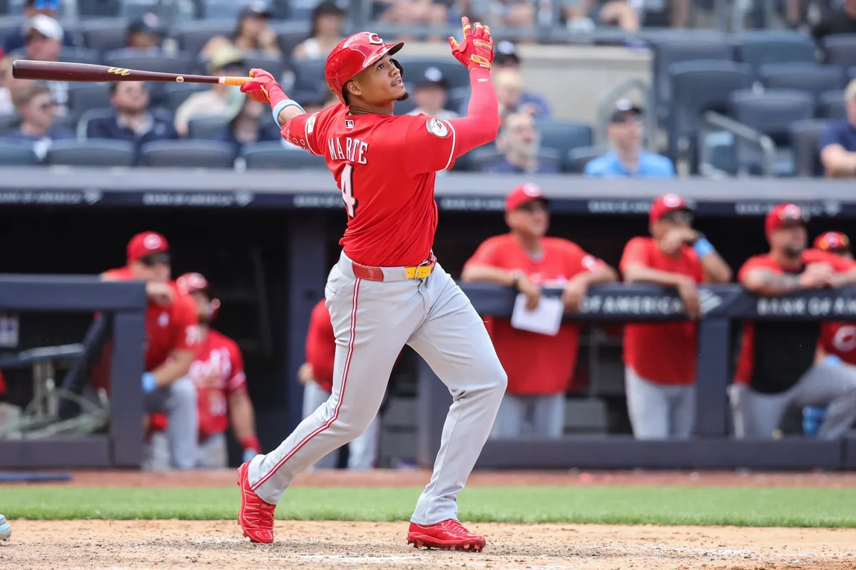 Jun 21, 2026; Bronx, New York, USA; Cincinnati Reds right fielder Noelvi Marte (4) hits an RBI double in the ninth inning against the New York Yankees at Yankee Stadium. Mandatory Credit: Wendell Cruz-Imagn Images