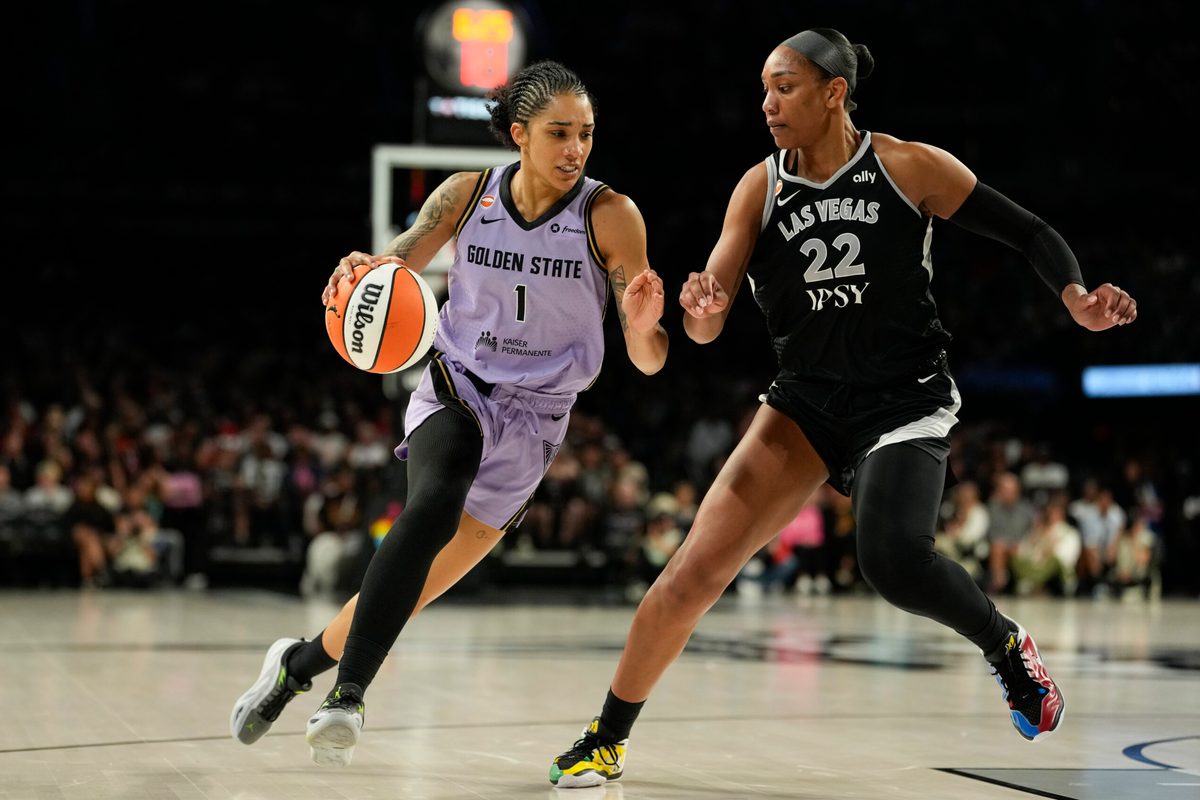 Jun 21, 2026; Las Vegas, Nevada, USA; Golden State Valkyries forward Gabby Williams (1) drives the ball against Las Vegas Aces center A'ja Wilson (22) during the third quarter of a WNBA basketball game at Michelob Ultra Arena. Mandatory Credit: Lucas Peltier-Imagn Images