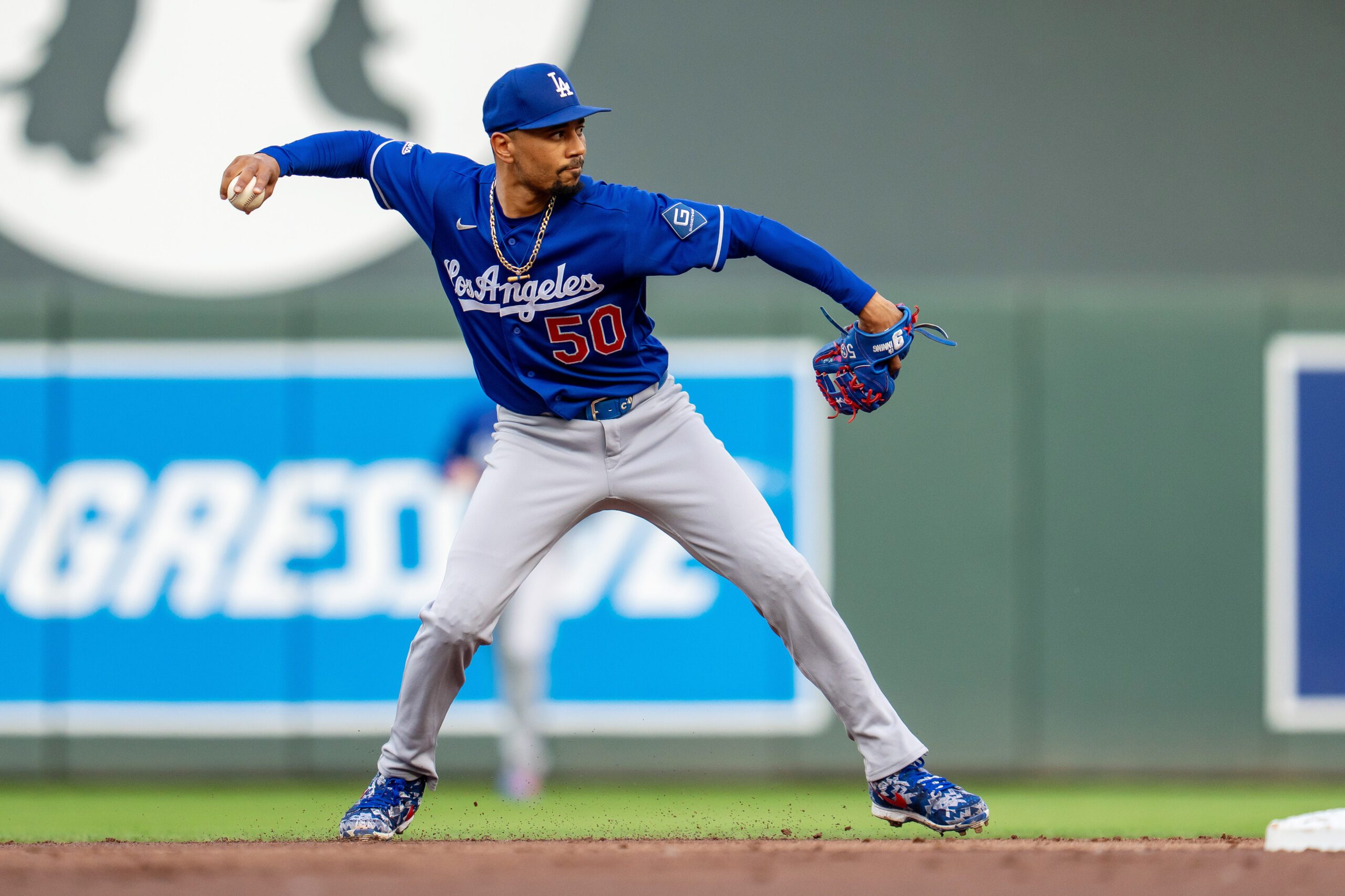 Jun 22, 2026; Minneapolis, Minnesota, USA; Los Angeles Dodgers shortstop Mookie Betts (50) throws the ball to first base for an out against the Minnesota Twins in the first inning at Target Field. Mandatory Credit: Jesse Johnson-Imagn Images