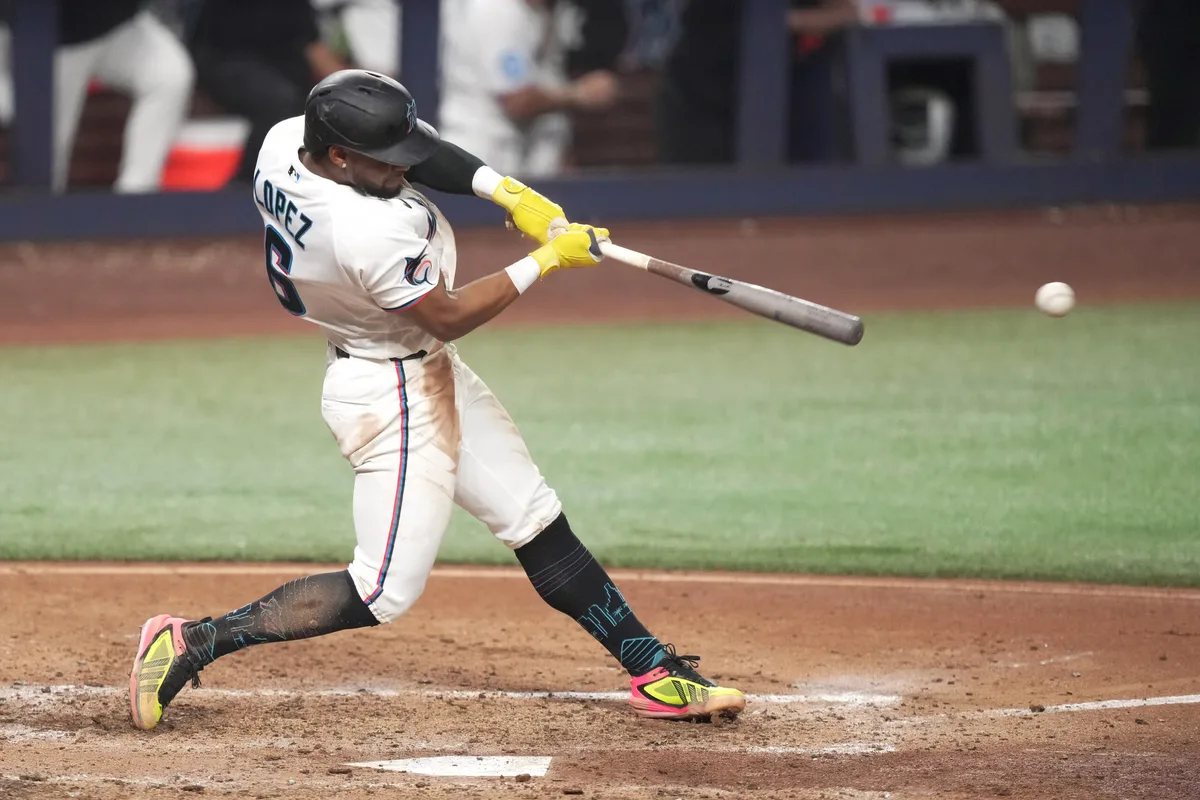Jun 22, 2026; Miami, Florida, USA; Miami Marlins shortstop Otto Lopez (6) hits a double in the sixth inning against the Texas Rangers at loanDepot Park. Mandatory Credit: Jim Rassol-Imagn Images